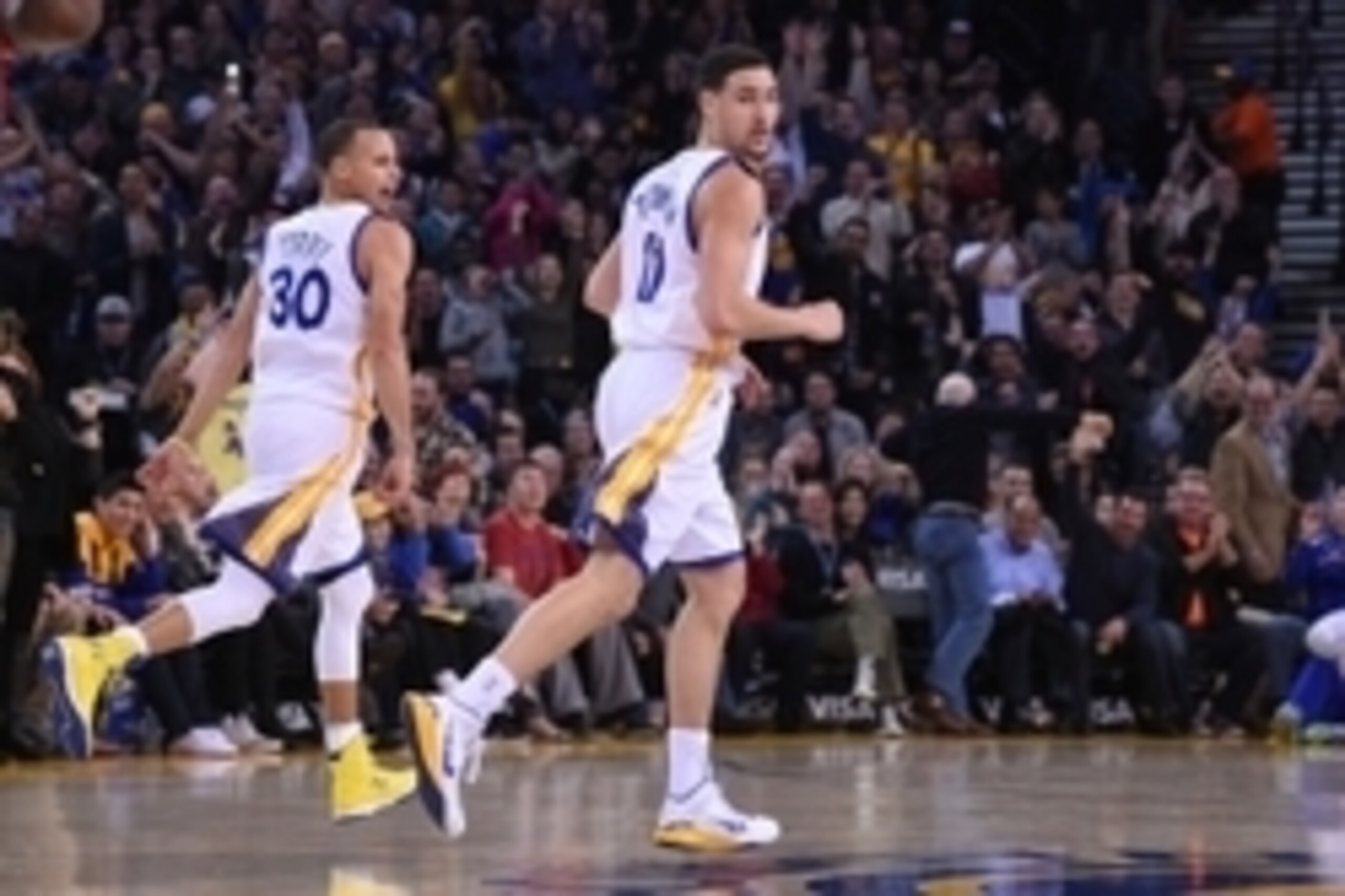 January 2, 2015; Oakland, CA, USA; Golden State Warriors guard Stephen Curry (30) celebrates with guard Klay Thompson (11) after Thompson made a three-point basket during the third quarter against the Toronto Raptors at Oracle Arena. The Warriors defeated January 2, 2015; Oakland, CA, USA; Golden State Warriors guard Stephen Curry (30) celebrates with guard Klay Thompson (11) after Thompson made a three-point basket during the third quarter against the Toronto Raptors at Oracle Arena. The Warriors defeated