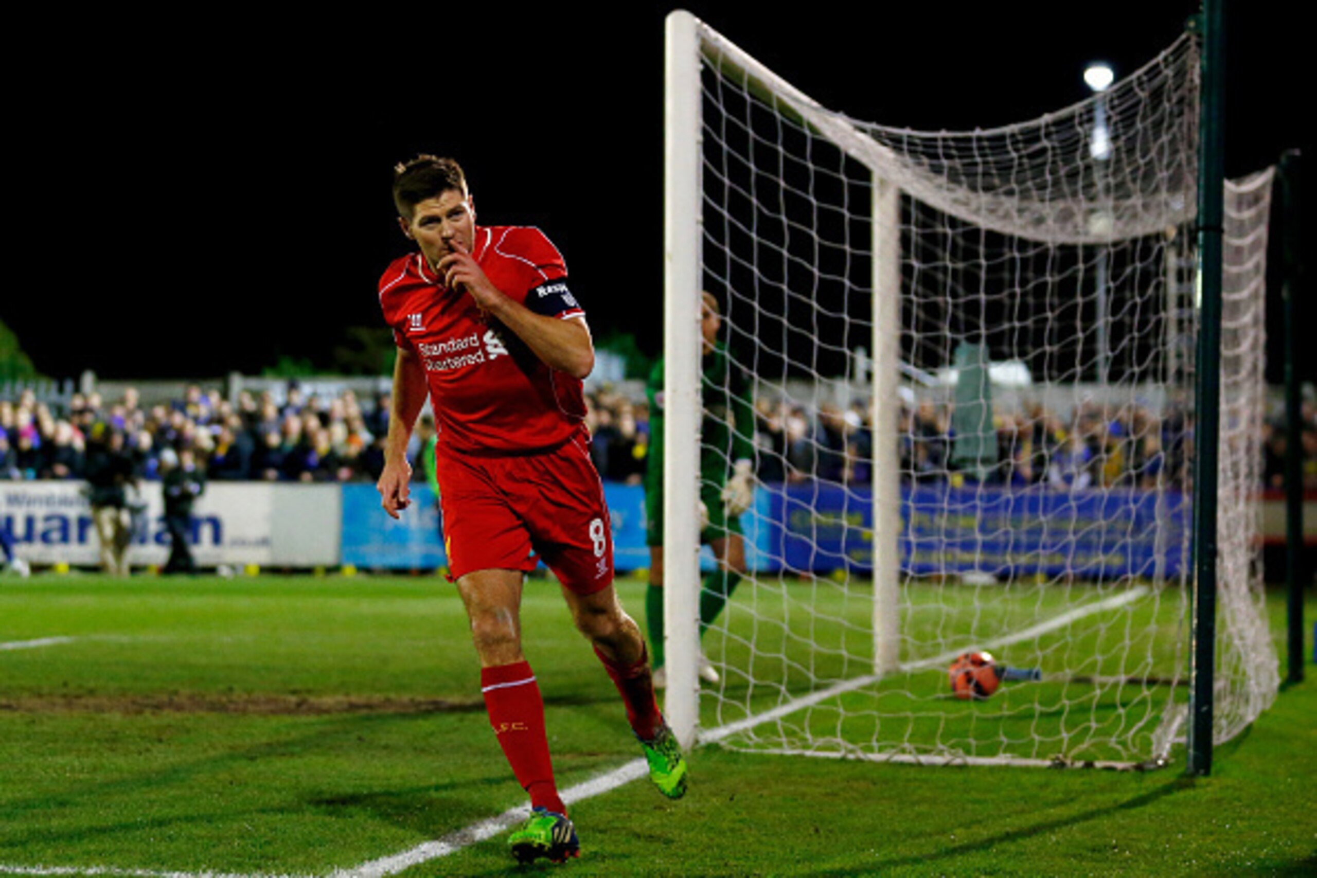 KINGSTON UPON THAMES, ENGLAND - JANUARY 05:  Steven Gerrard of Liverpool celebrates after scoring the opening goal with a header during the FA Cup Third Round match between AFC Wimbledon and Liverpool at The Cherry Red Records Stadium on January 5, 2015 i