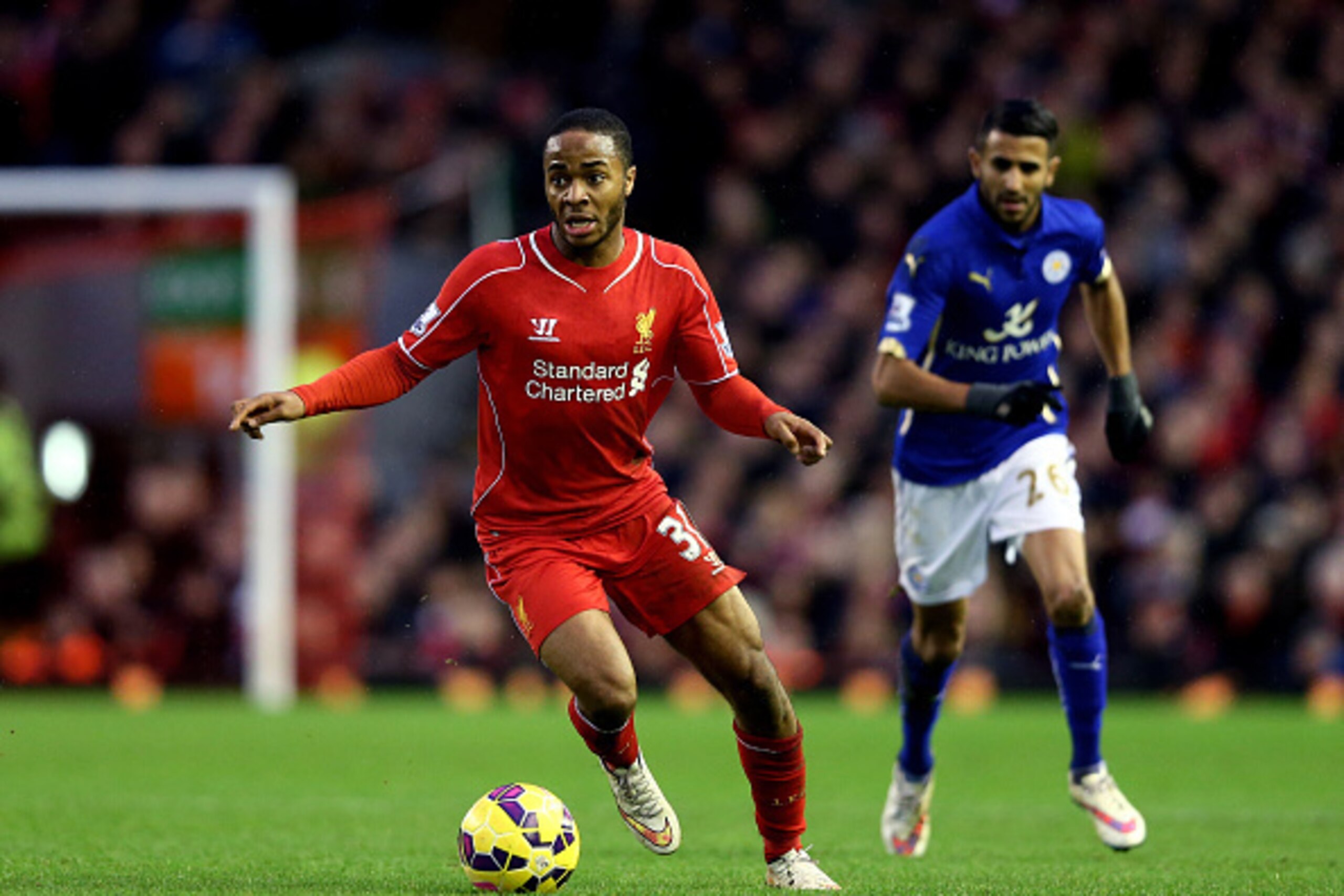 LIVERPOOL, ENGLAND - JANUARY 01:  Raheem Sterling of Liverpool runs with the ball during the Barclays Premier League match between Liverpool and Leicester City at Anfield on January 1, 2015 in Liverpool, England.  (Photo by Clive Brunskill/Getty Images)
