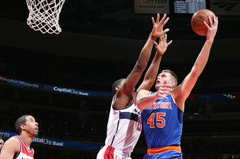WASHINGTON, DC -  JANUARY 7: Cole Aldrich #45 of the New York Knicks goes for the lay up against the Washington Wizards during the game on January 7, 2015 at Verizon Center in Washington, DC. NOTE TO USER: User expressly acknowledges and agrees that, by d