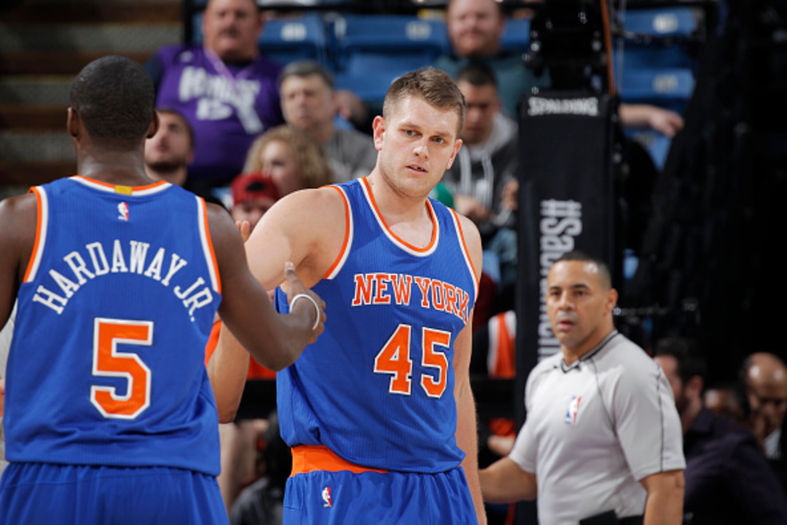 SACRAMENTO, CA - DECEMBER 27: Cole Aldrich #45 of the New York Knicks high fives teammate Tim Hardaway Jr. #5 against the Sacramento Kings on December 27, 2014 at Sleep Train Arena in Sacramento, California. NOTE TO USER: User expressly acknowledges and a