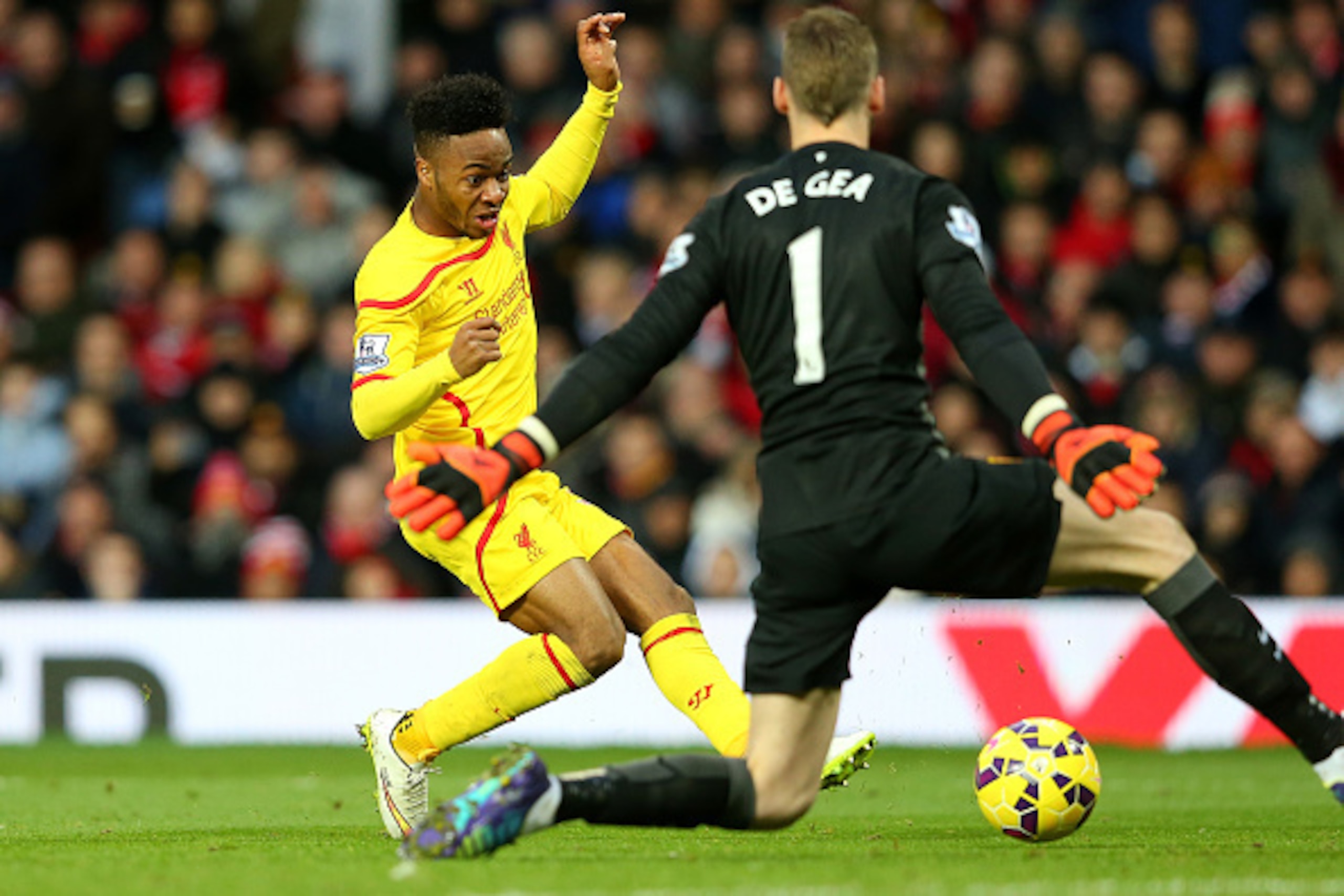 MANCHESTER, ENGLAND - DECEMBER 14:  Dvid De Gea of Manchester United saves the attempt on goal of Raheem Sterling of Liverpool in a one on one situation during the Barclays Premier League match between Manchester United and Liverpool at Old Trafford on De