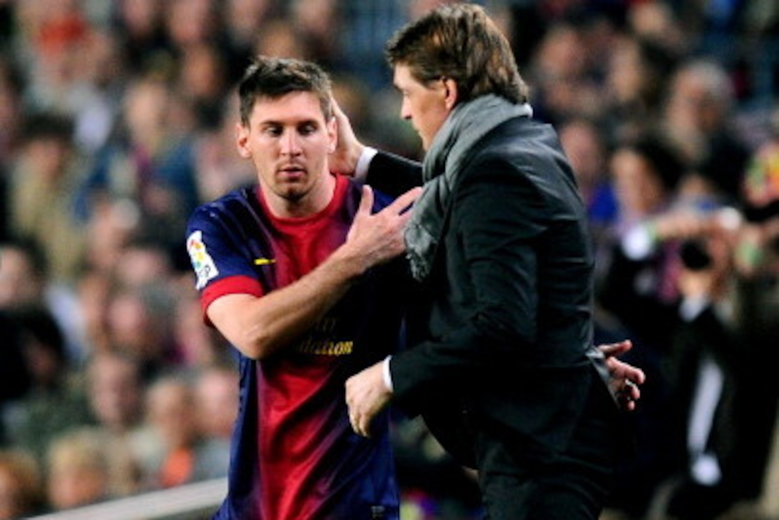 BARCELONA, SPAIN - MAY 05:  Lionel Messi of Barcelona speaks with Tito Vilanova the Barcelona head coach as he prepares to come off the bench during the La Liga match between FC Barcelona and Real Betis Balompie at Camp Nou on May 5, 2013 in Barcelona, Sp