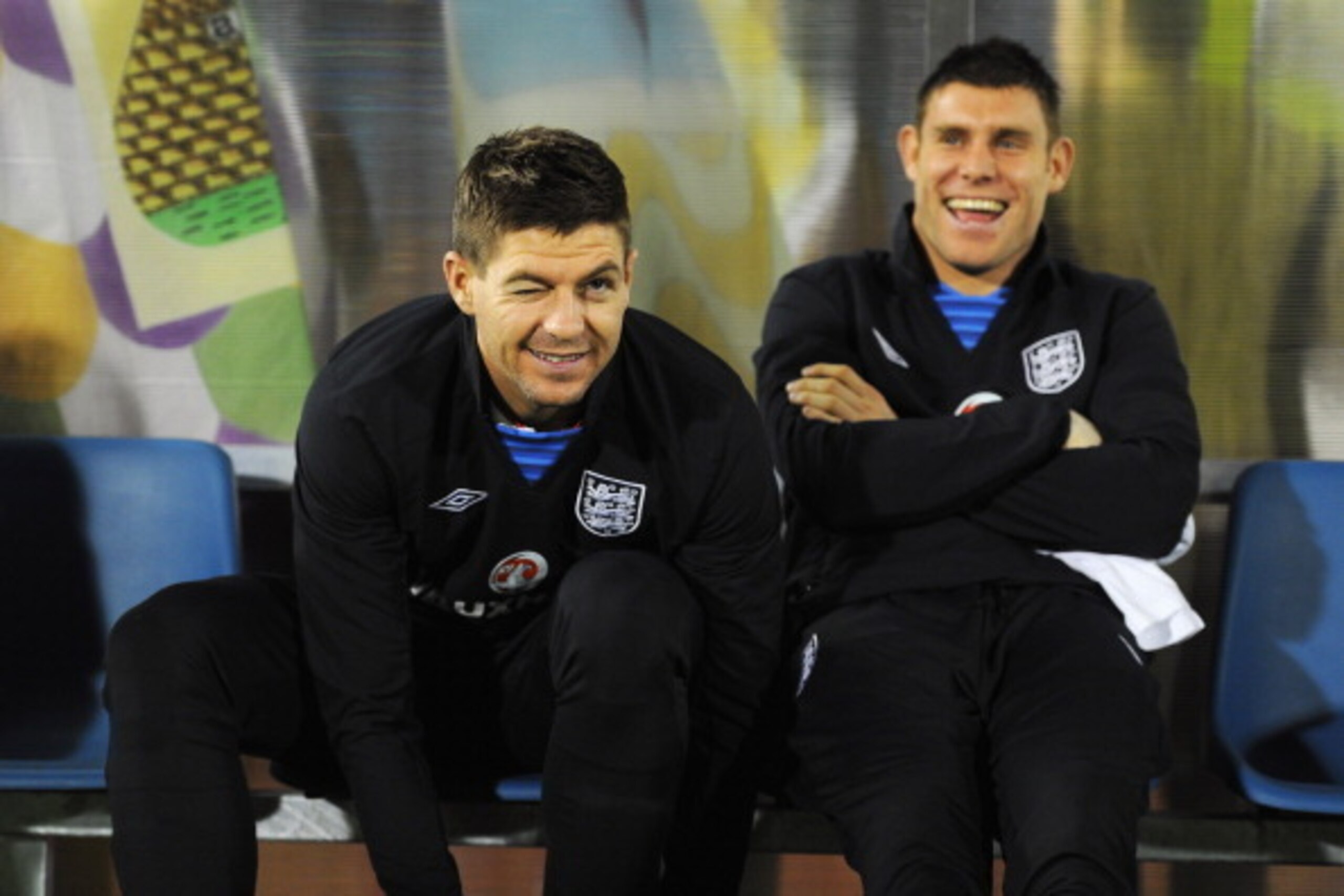 SERRAVALLE, SAN MARINO - MARCH 22:  Steven Gerrard (L) of England shares a joke with James Milner prior to the FIFA 2014 World Cup Qualifier Group H match between San Marino and England at Serravalle Stadium on March 22, 2013 in Serravalle, San Marino.  (