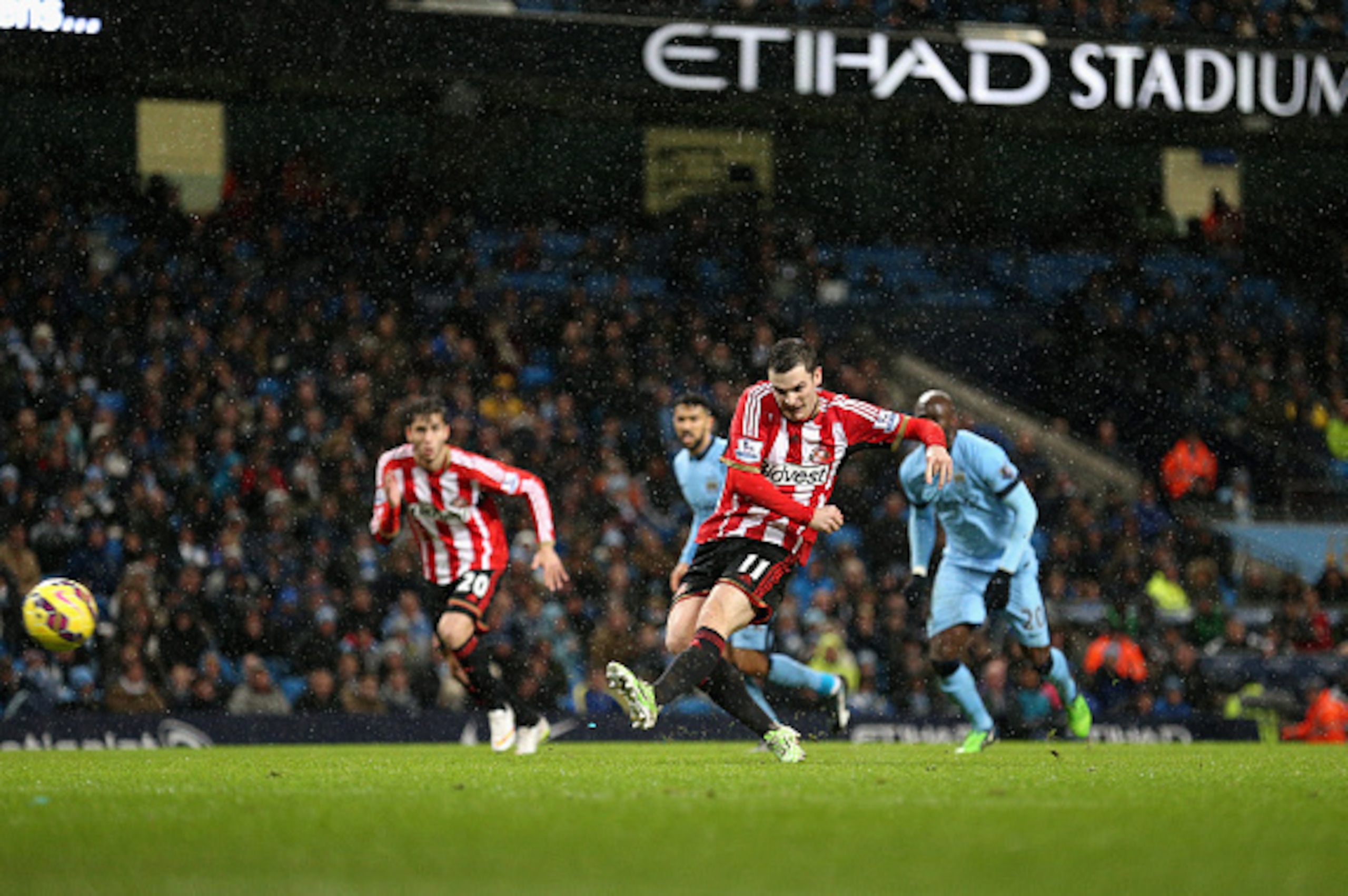 MANCHESTER, ENGLAND - JANUARY 01:  Adam Johnson of Sunderland shoots and scores from the penalty spot during the Barclays Premier League match between Manchester City and Sunderland at Etihad Stadium on January 1, 2015 in Manchester, England.  (Photo by C