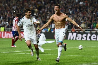 LISBON, PORTUGAL - MAY 24:  Cristiano Ronaldo of Real Madrid celebrates after scoring their fourth goal from the penalty spot during the UEFA Champions League Final between Real Madrid and Atletico de Madrid at Estadio da Luz on May 24, 2014 in Lisbon, Po