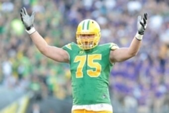 Oct 18, 2014; Eugene, OR, USA; Oregon Ducks offensive lineman Jake Fisher (75) motivates the crowd against the Washington Huskies at Autzen Stadium. Mandatory Credit: Scott Olmos-USA TODAY Sports