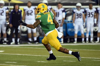 EUGENE,OR - OCTOBER 18: Defensive back Erick Dargan #4 of the Oregon Ducks runs back an interception during the second quarter of the game against the Washington Huskies at Autzen Stadium on October 18, 2014 in Eugene, Oregon. (Photo by Steve Dykes/Getty