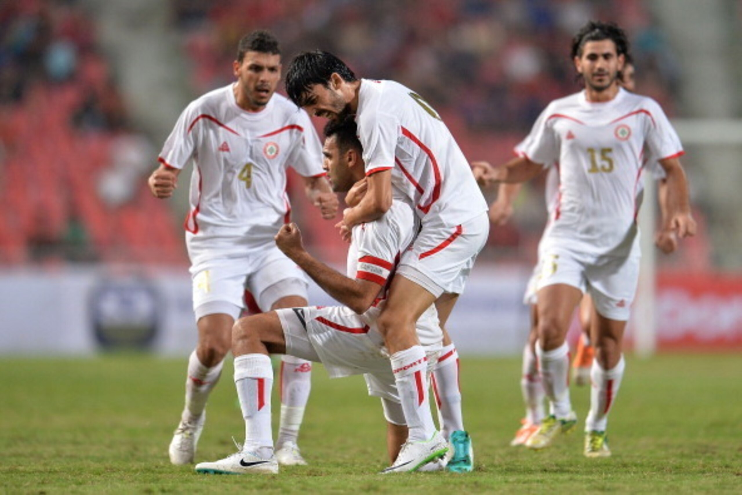 BANGKOK, THAILAND - MARCH 05: Roda Natar #20 of Lebanon celebrates with his team during the AFC Asian Cup 2015 Group B Qualifier match between Thailand and Lebanon at Rajamangala Stadium on March 5, 2014 in Bangkok, Thailand.  (Photo by Thananuwat Srirasa