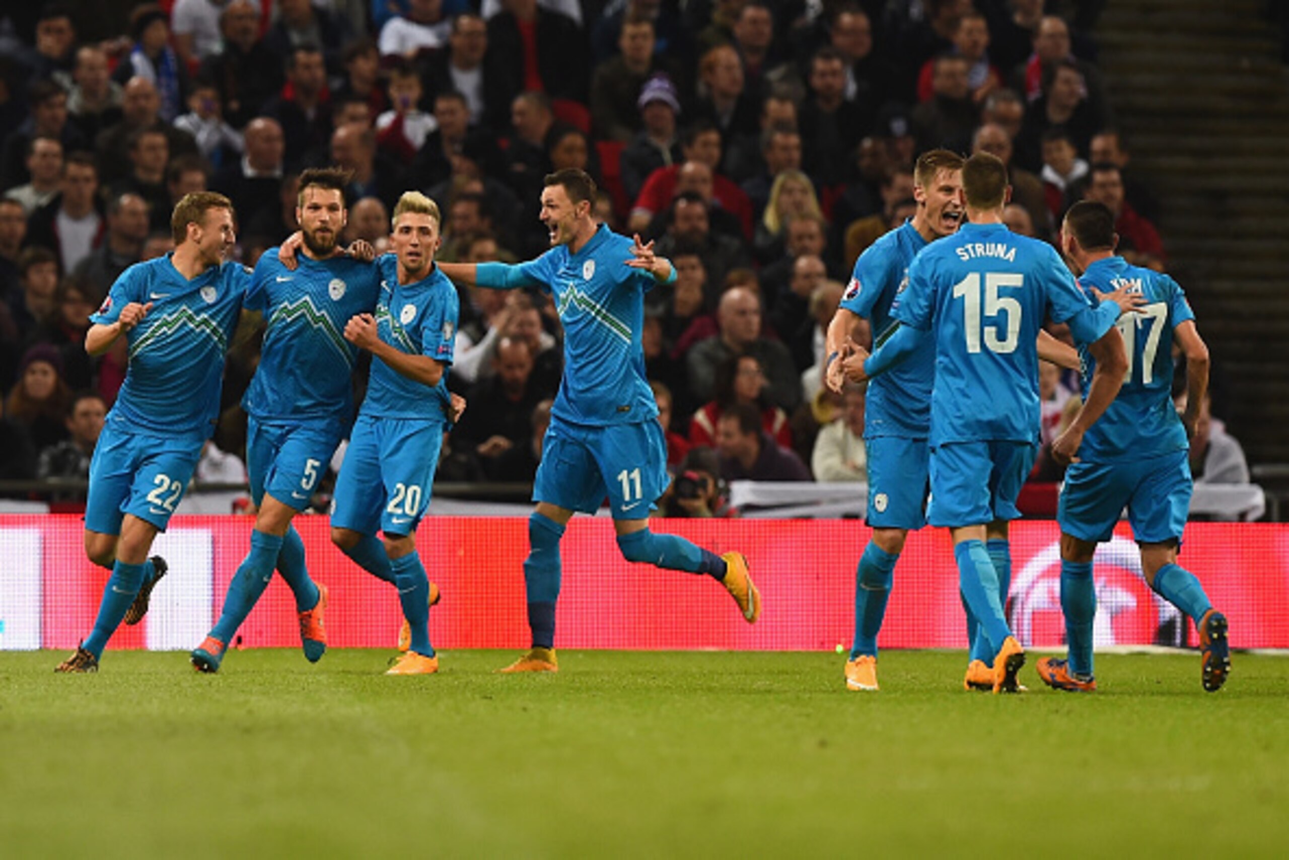 LONDON, ENGLAND - NOVEMBER 15: Slovenia players celebrate the England own-goal that saw them take the lead 1-0  during the EURO 2016 Qualifier Group E match between England and Slovenia at Wembley Stadium on November 15, 2014 in London, England.  (Photo b