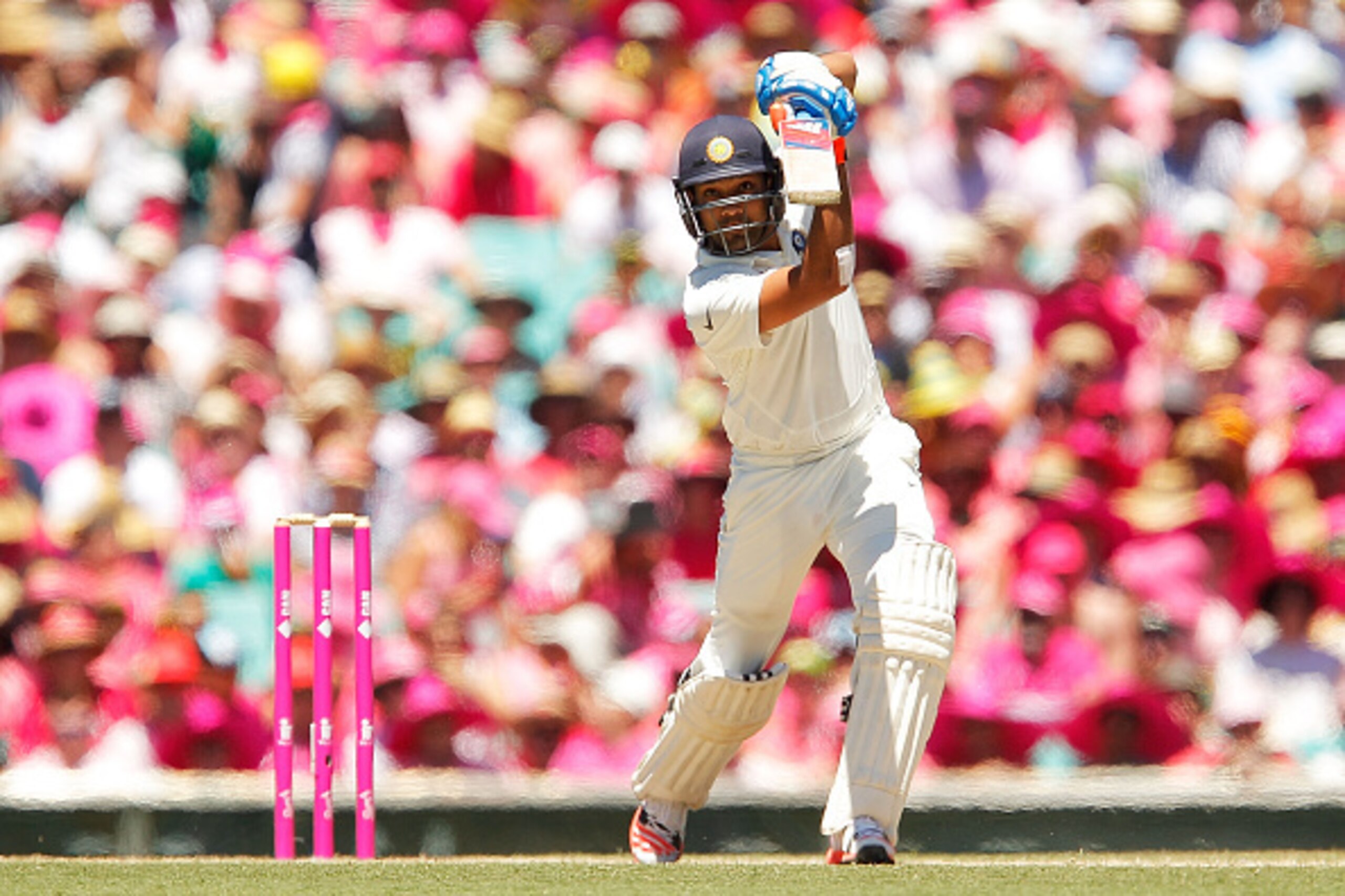 SYDNEY, AUSTRALIA - JANUARY 08:  Rohit Sharma of India plays a cover drive during day three of the Fourth Test match between Australia and India at Sydney Cricket Ground on January 8, 2015 in Sydney, Australia.  (Photo by Brendon Thorne/Getty Images)
