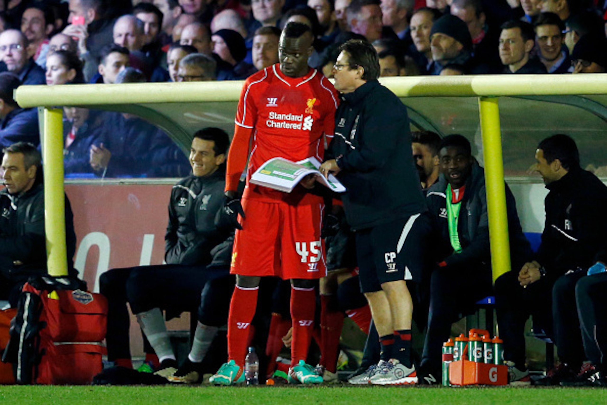 KINGSTON UPON THAMES, ENGLAND - JANUARY 05:  Mario Balotelli of Liverpool prepares to come on as a second half substitute during the FA Cup Third Round match between AFC Wimbledon and Liverpool at The Cherry Red Records Stadium on January 5, 2015 in Kings