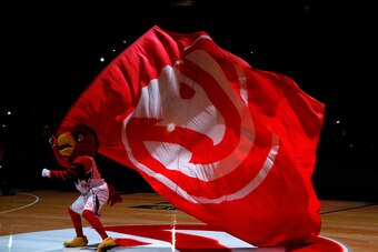 ATLANTA, GA - JANUARY 07:  Harry the Hawk waves a flag during pregame introductions prior to the game between the Atlanta Hawks and the Memphis Grizzlies at Philips Arena on January 7, 2015 in Atlanta, Georgia.  NOTE TO USER: User expressly acknowledges a