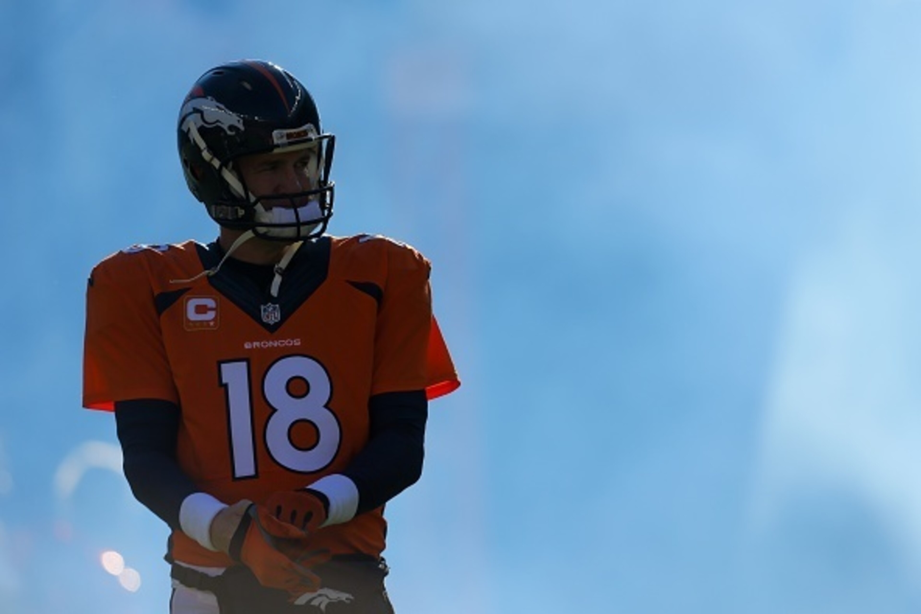 DENVER, CO - DECEMBER 28:  Quarterback Peyton Manning #18 of the Denver Broncos emerges from the tunnel during player introductions before a game against the Oakland Raiders at Sports Authority Field at Mile High on December 28, 2014 in Denver, Colorado. 