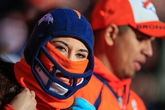 DENVER, CO - DECEMBER 28:  A fan wears a hat and neck gator to stay warm in potentially cold weather before a game between the Denver Broncos and the Oakland Raiders at Sports Authority Field at Mile High on December 28, 2014 in Denver, Colorado.  (Photo 