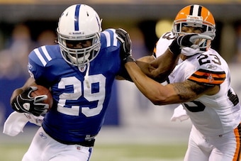 INDIANAPOLIS, IN - SEPTEMBER 18:  Joseph Addai #29 of the Indianapolis Colts carries the ball against Joe Haden #23 of the Cleveland Browns at Lucas Oil Stadium on September 18, 2011 in Indianapolis, Indiana.  (Photo by Matthew Stockman/Getty Images)