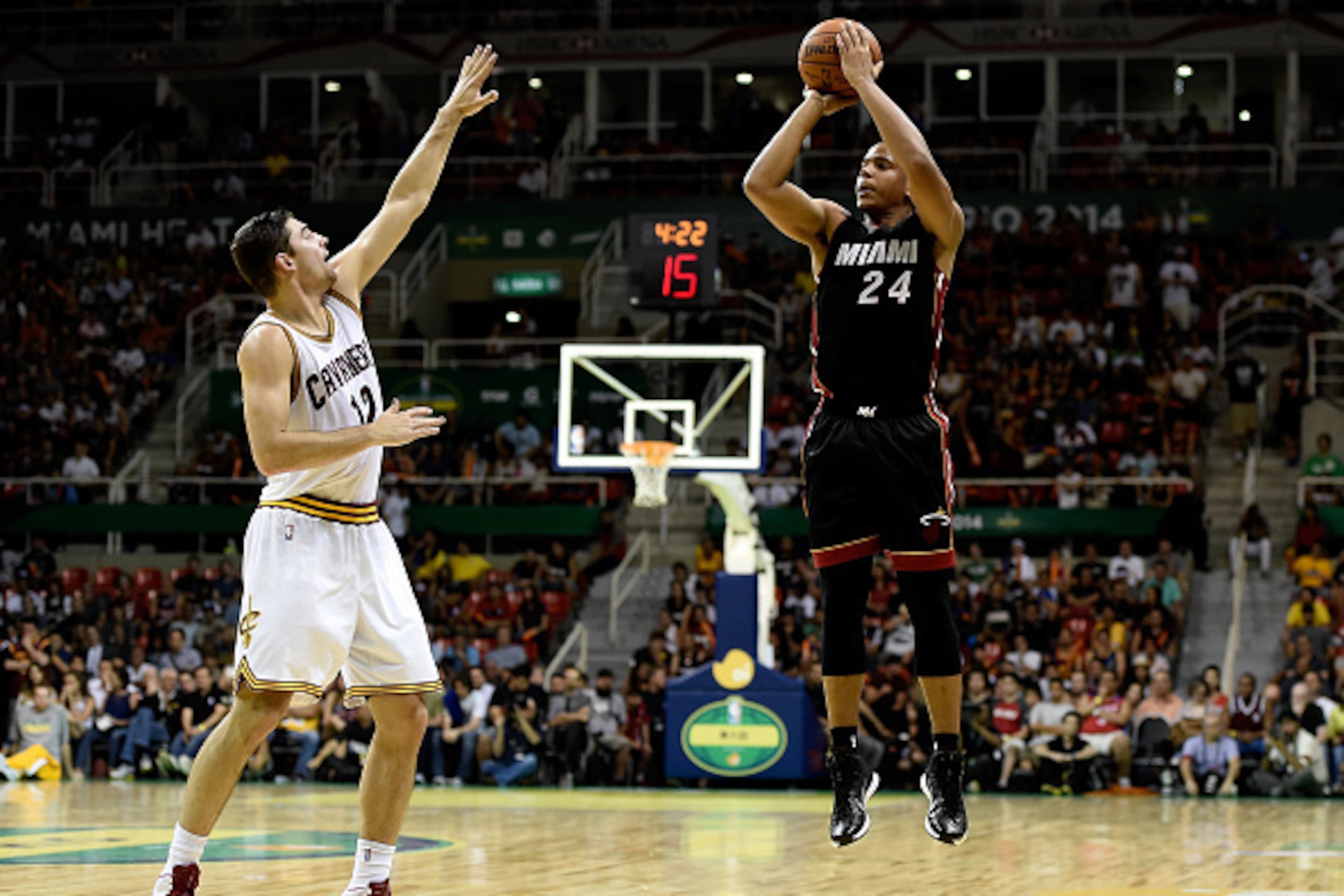 RIO DE JANEIRO, BRAZIL - OCTOBER 11: Andre Dawkins #24 of the Miami Heat shoots against Joe Harris #12 of the Cleveland Cavaliers at Arena HSBC on October 11, 2014 in Rio de Janeiro, Brazil. NOTE TO USER: User expressly acknowledges and agrees that, by do