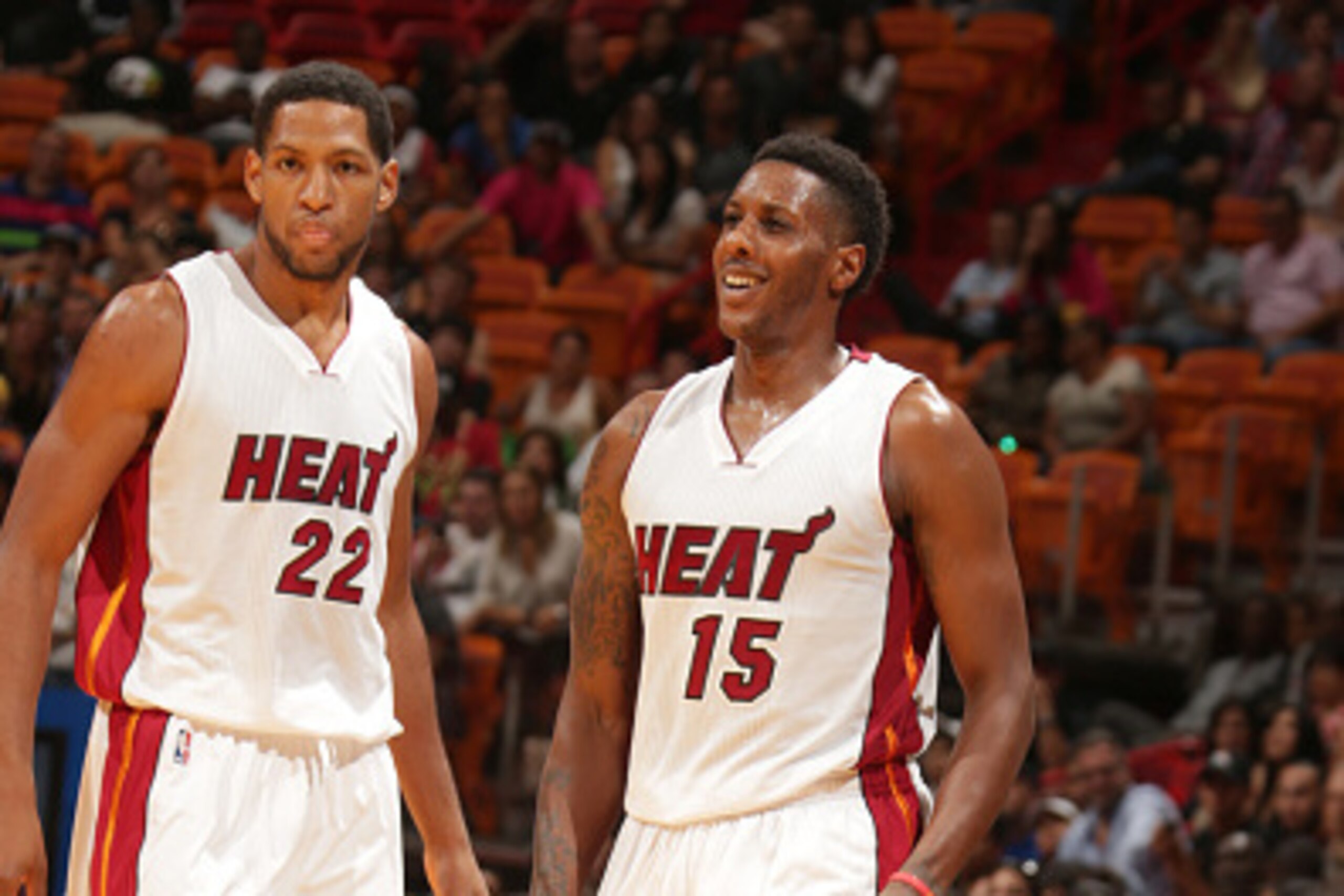 MIAMI, FL - October 7: Danny Granger #22 and Mario Chalmers #16 of the Miami Heat observe the game against the Orlando Magic at the American Airlines Arena in Miami, Florida on October 7, 2014. NOTE TO USER: User expressly acknowledges and agrees that, by