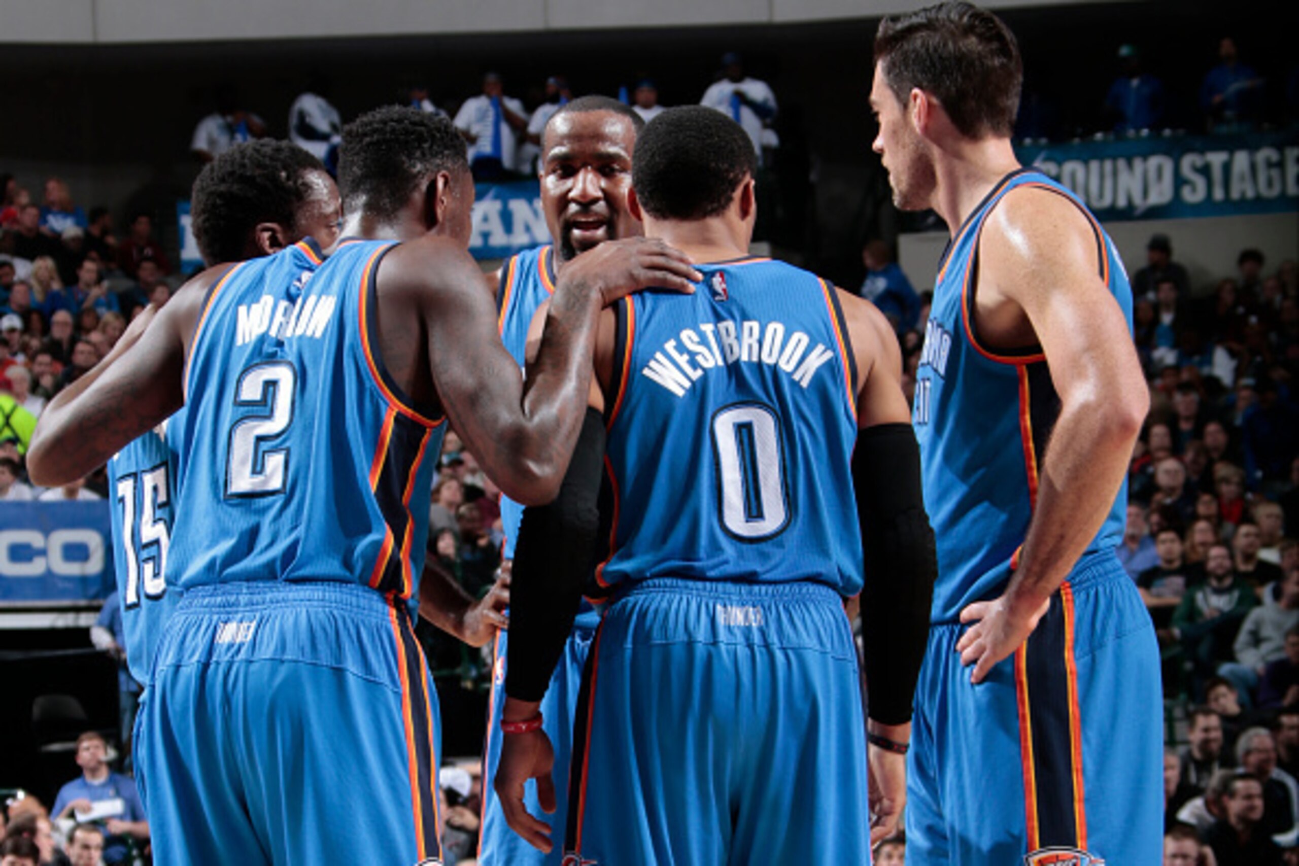 DALLAS, TX - DECEMBER 28: Kendrick Perkins #5, Reggie Jackson #15, Russell Westbrook #0, Anthony Morrow #2, and Nick Collison #4 of the Oklahoma City Thunder huddle up during a break in the action against the Dallas Mavericks on December 28, 2014 at the A