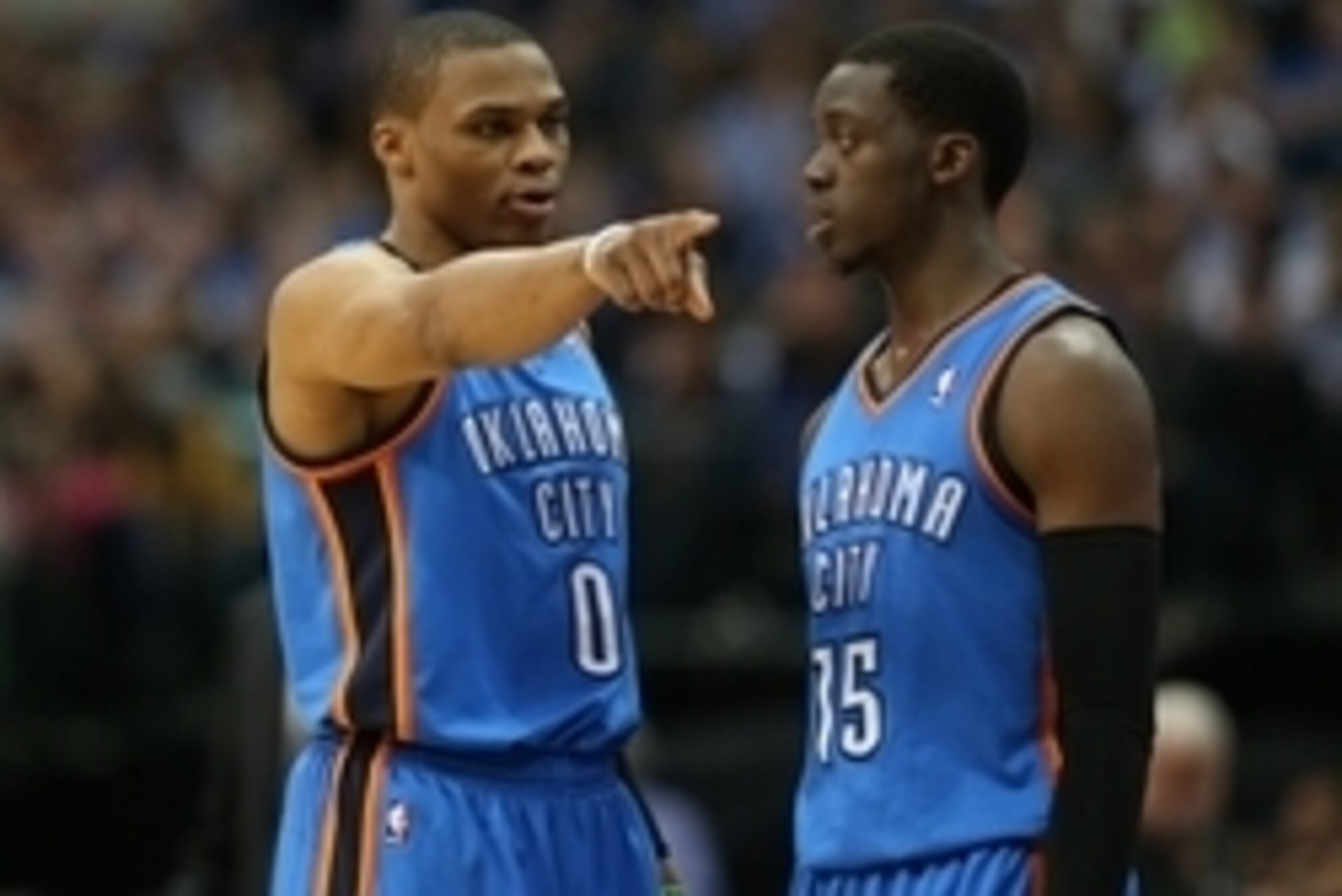 Mar 25, 2014; Dallas, TX, USA; Oklahoma City Thunder guard Russell Westbrook (0) talk with guard Reggie Jackson (15) during a timeout from the game  in the second quarter against the Dallas Mavericks at American Airlines Center. Mandatory Credit: Matthew 