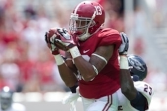 Sep 6, 2014; Tuscaloosa, AL, USA; Alabama Crimson Tide wide receiver ArDarius Stewart (13) catches a pass as Florida Atlantic Owls defensive back Raekwon Williams (23) defends at Bryant-Denny Stadium. Mandatory Credit: Marvin Gentry-USA TODAY Sports