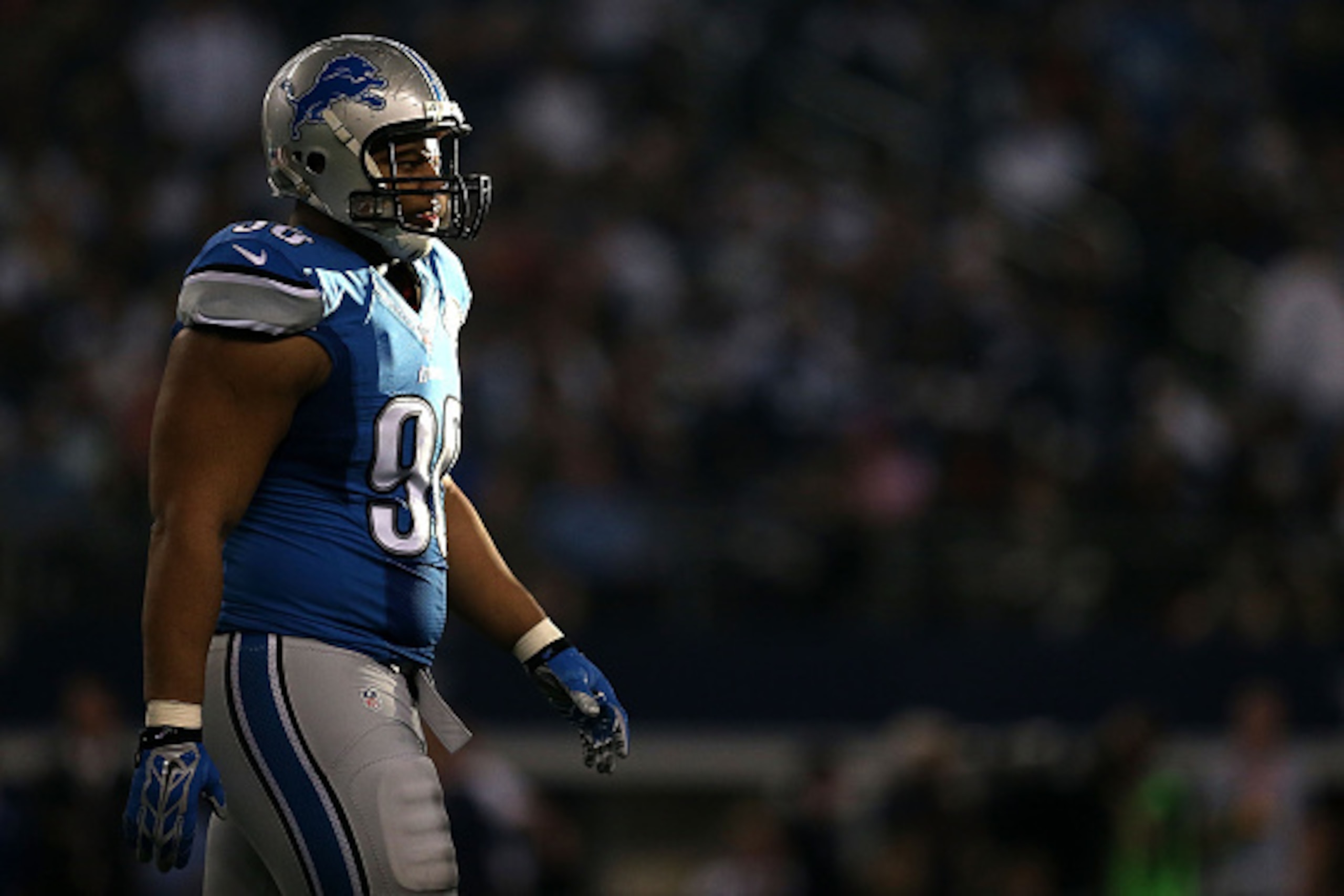 ARLINGTON, TX - JANUARY 04:  Ndamukong Suh #90 of the Detroit Lions walks towards the sideline after a possession against the Dallas Cowboys during the first half of their NFC Wild Card Playoff game at AT&T Stadium on January 4, 2015 in Arlington, Texas. 