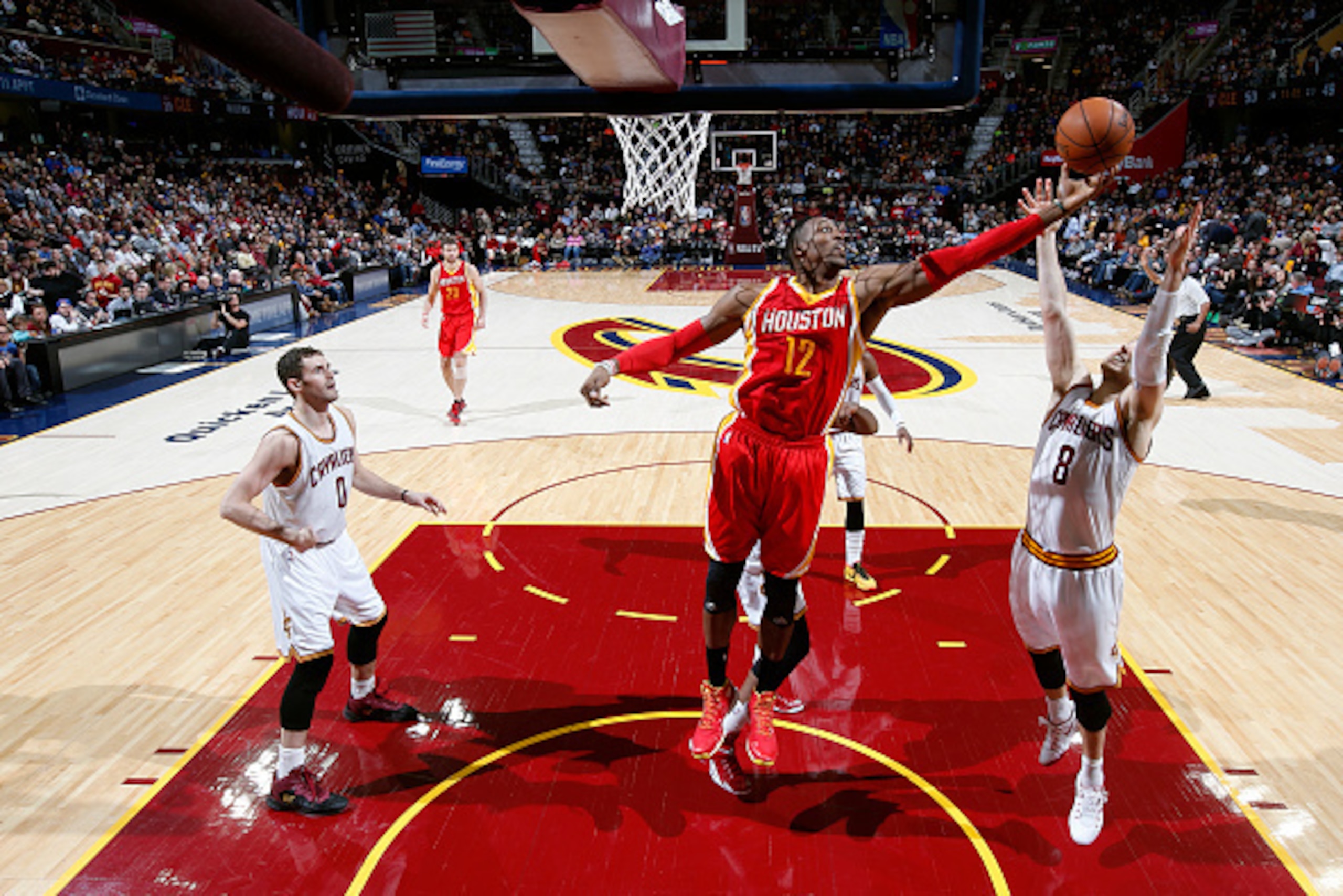 CLEVELAND, OH - JANUARY 7:  Dwight Howard #12 of the Houston Rockets grabs a rebound against the Cleveland Cavaliers on January 7, 2015 at Quicken Loans Arena in Cleveland, Ohio. NOTE TO USER: User expressly acknowledges and agrees that, by downloading an