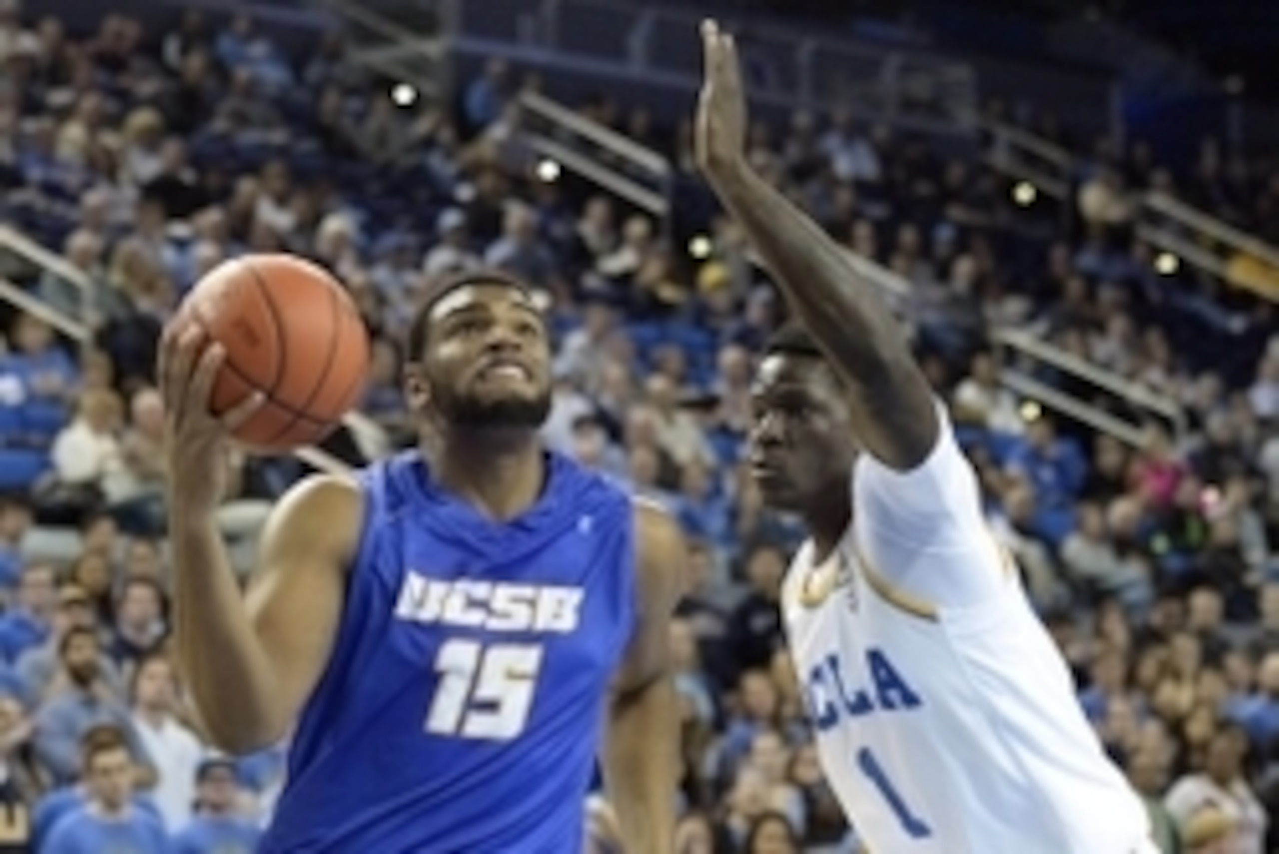 Dec 3, 2013; Los Angeles, CA, USA; UC Santa Barbara Gauchos center Alan Williams (15) drives against UCLA Bruins forward Wanaah Bail during the game at Pauley Pavilion. Mandatory Credit: Richard Mackson-USA TODAY Sports