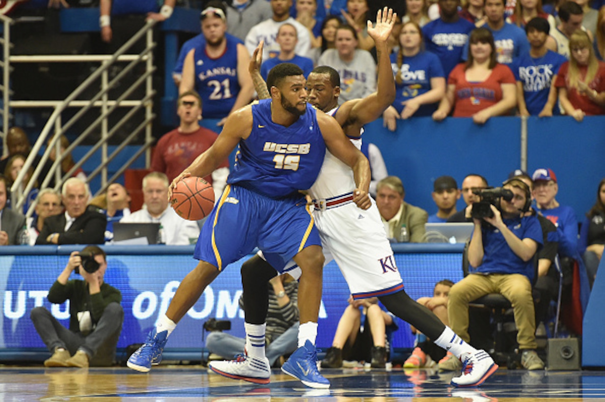 LAWRENCE, KS - NOVEMBER 14:  Alan Williams #15 of the UC Santa Barbara Gauchos posts up Cliff Alexander #2 of the Kansas Jayhawks in the second half at Allen Fieldhouse on November 14, 2014 in Lawrence, Kansas. (Photo by Michael B. Thomas/Getty Images)