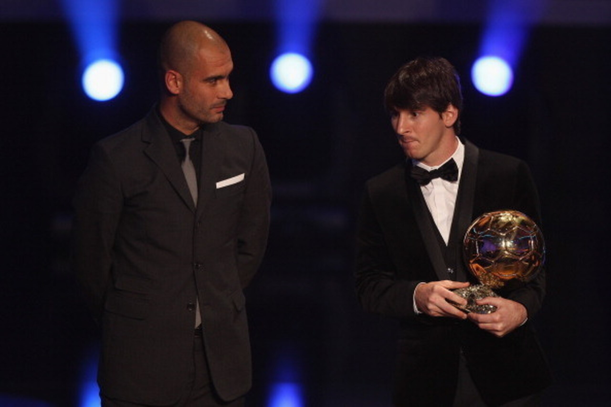 ZURICH, SWITZERLAND - JANUARY 10:  Lionel Messi (r) of Argentina and Barcelona FC receives the men's player of the year award from his club coach Pep Guardiola during the FIFA Ballon d'or Gala at the Zurich Kongresshaus on January 10, 2011 in Zurich, Swit