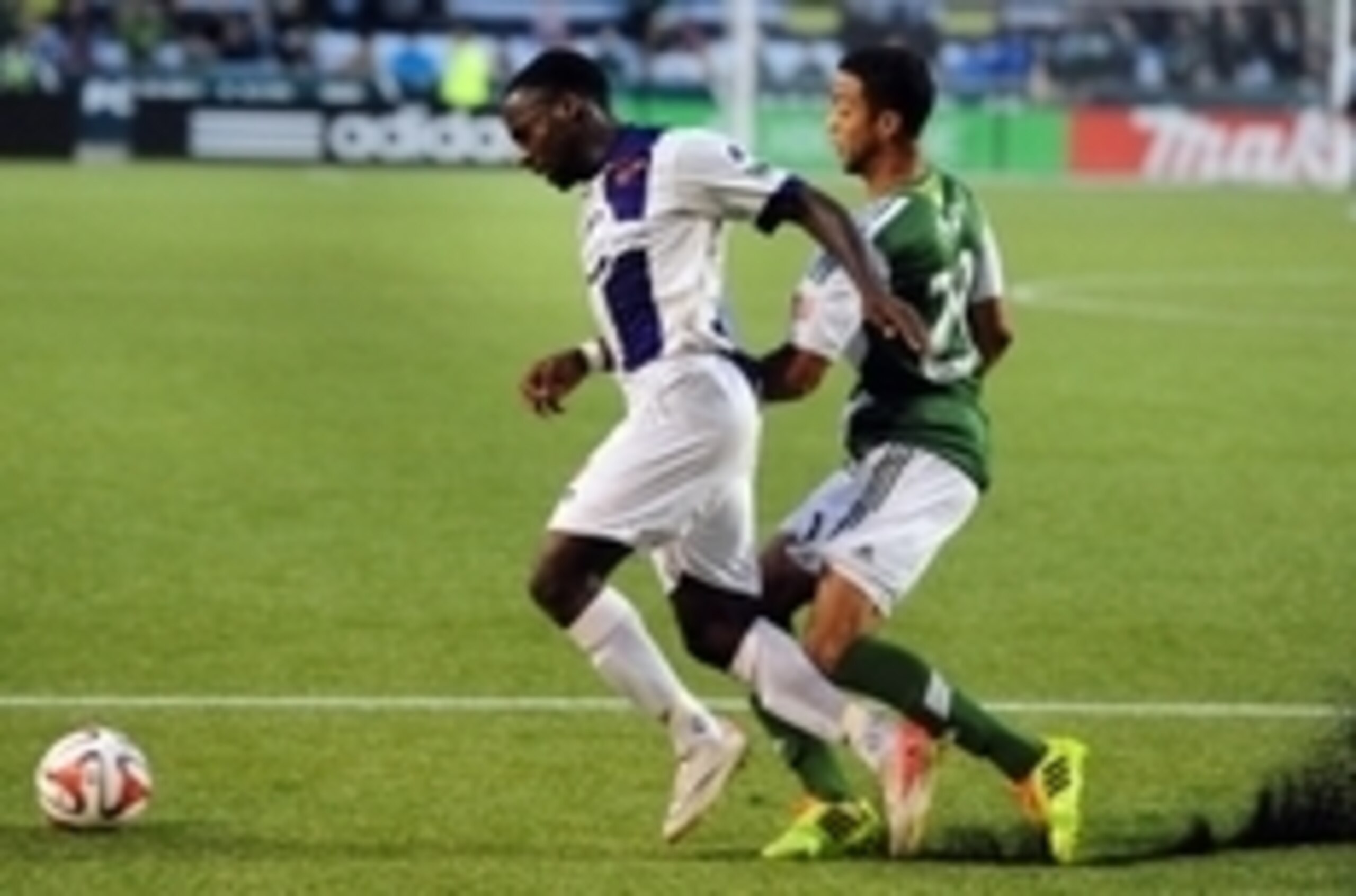 Jun 17, 2014; Portland, OR, USA; Orlando City defender Boyd Okwuonu (2) goes after a ball with Portland Timbers defender Taylor Peay (20) during the second half of the game at Providence Park. Mandatory Credit: Steve Dykes-USA TODAY Sports Jun 17, 2014; Portland, OR, USA; Orlando City defender Boyd Okwuonu (2) goes after a ball with Portland Timbers defender Taylor Peay (20) during the second half of the game at Providence Park. Mandatory Credit: Steve Dykes-USA TODAY Sports