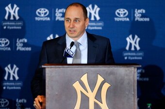 NEW YORK, NY - FEBRUARY 11:  General Manager Brian Cashman of the New York Yankees speaks during a news conference introducing Masahiro Tanaka (not pictured) to the media on February 11, 2014 at Yankee Stadium in the Bronx borough of New York City.  (Phot
