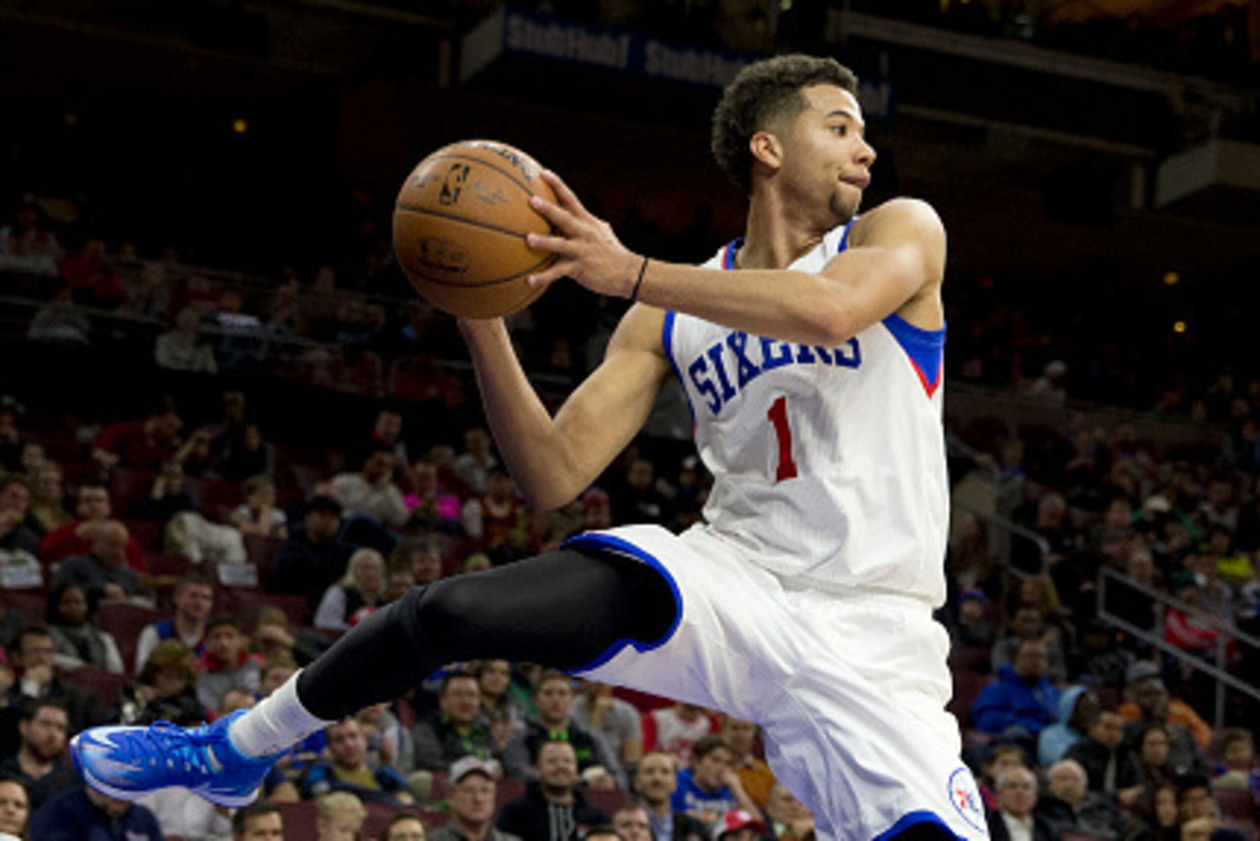 PHILADELPHIA, PA - JANUARY 5: Michael Carter-Williams #1 of the Philadelphia 76ers saves the ball from going out of bounds against the Cleveland Cavaliers on January 5, 2015 at the Wells Fargo Center in Philadelphia, Pennsylvania. The 76ers defeated the C