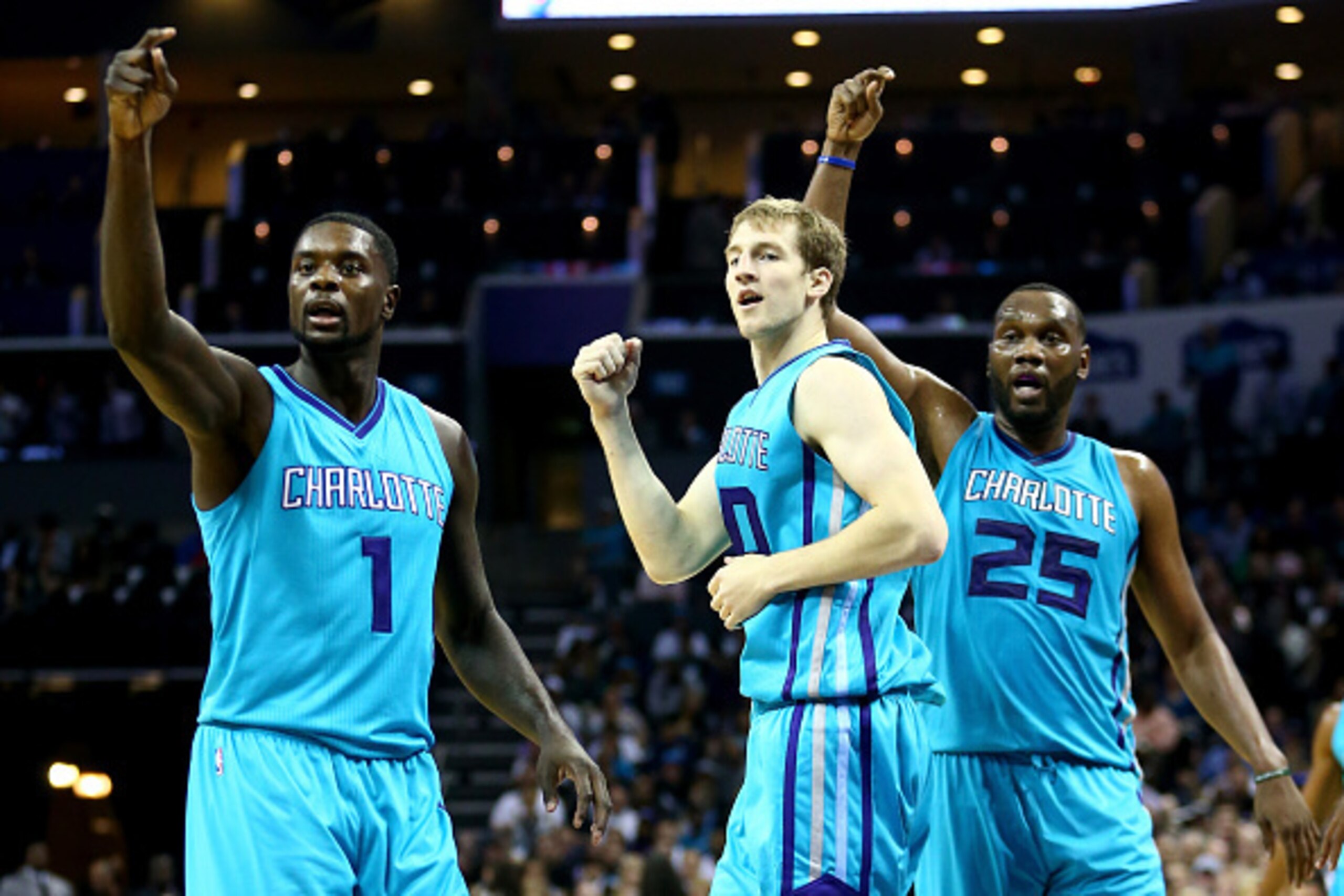 CHARLOTTE, NC - OCTOBER 29:  Teammates Lance Stephenson #1, Cody Zeller #40 and Al Jefferson #25 of the Charlotte Hornets react after a call against the Milwaukee Bucks during their game at Time Warner Cable Arena on October 29, 2014 in Charlotte, North C