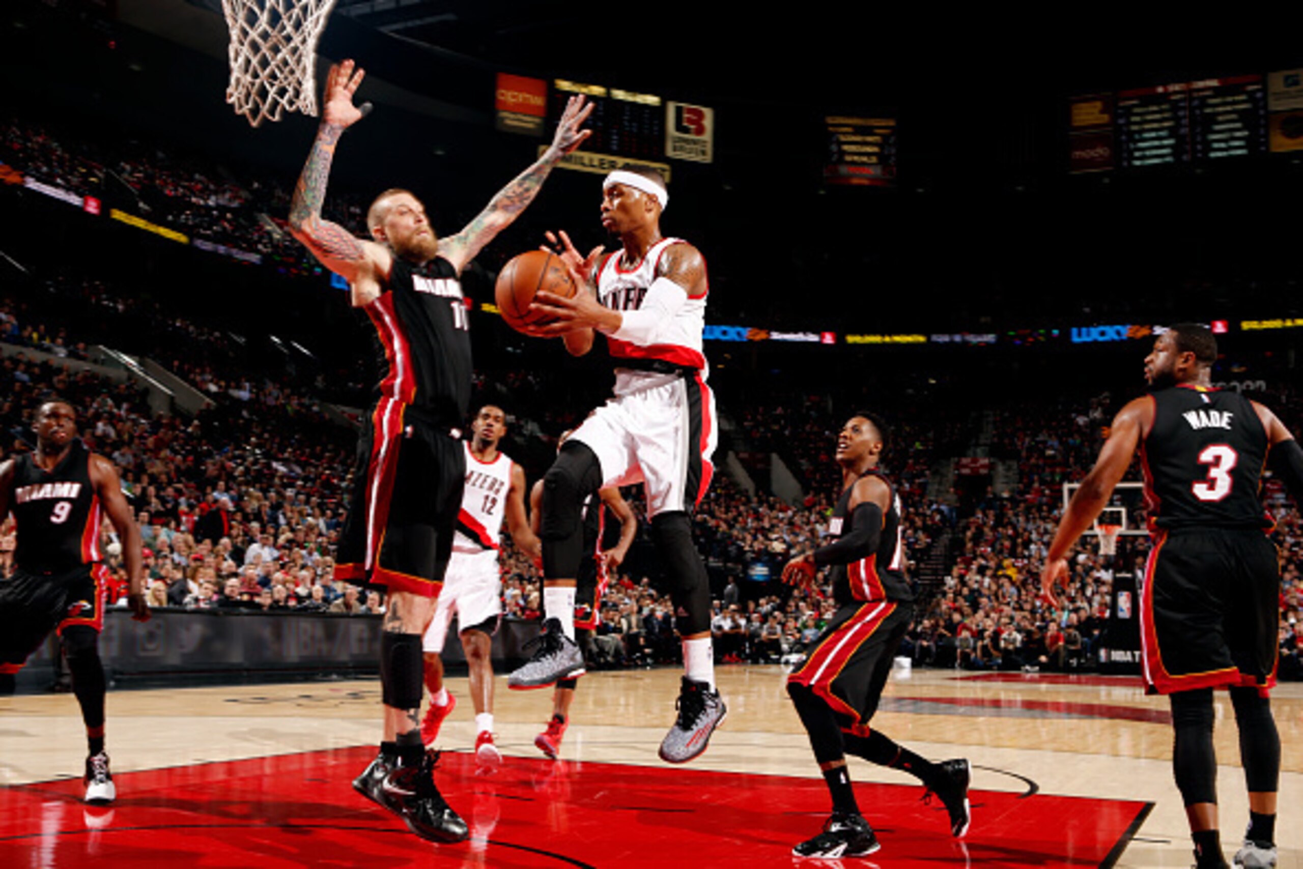 PORTLAND, OR - JANUARY 8: Damian Lillard #0 of the Portland Trail Blazers passes the ball against the Miami Heat on January 8, 2015 at the Moda Center Arena in Portland, Oregon. NOTE TO USER: User expressly acknowledges and agrees that, by downloading and PORTLAND, OR - JANUARY 8: Damian Lillard #0 of the Portland Trail Blazers passes the ball against the Miami Heat on January 8, 2015 at the Moda Center Arena in Portland, Oregon. NOTE TO USER: User expressly acknowledges and agrees that, by downloading and
