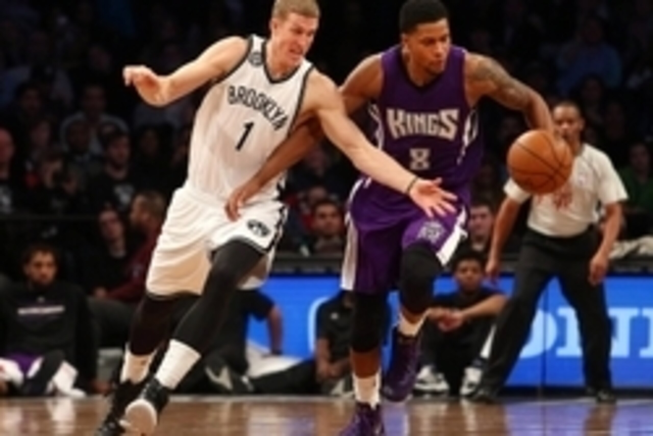 Dec 29, 2014; Brooklyn, NY, USA; Sacramento Kings small forward Rudy Gay (8) and Brooklyn Nets center Mason Plumlee (1) fight for a loose ball during the fourth quarter at Barclays Center. The Nets defeated the Kings 107-99. Mandatory Credit: Brad Penner-