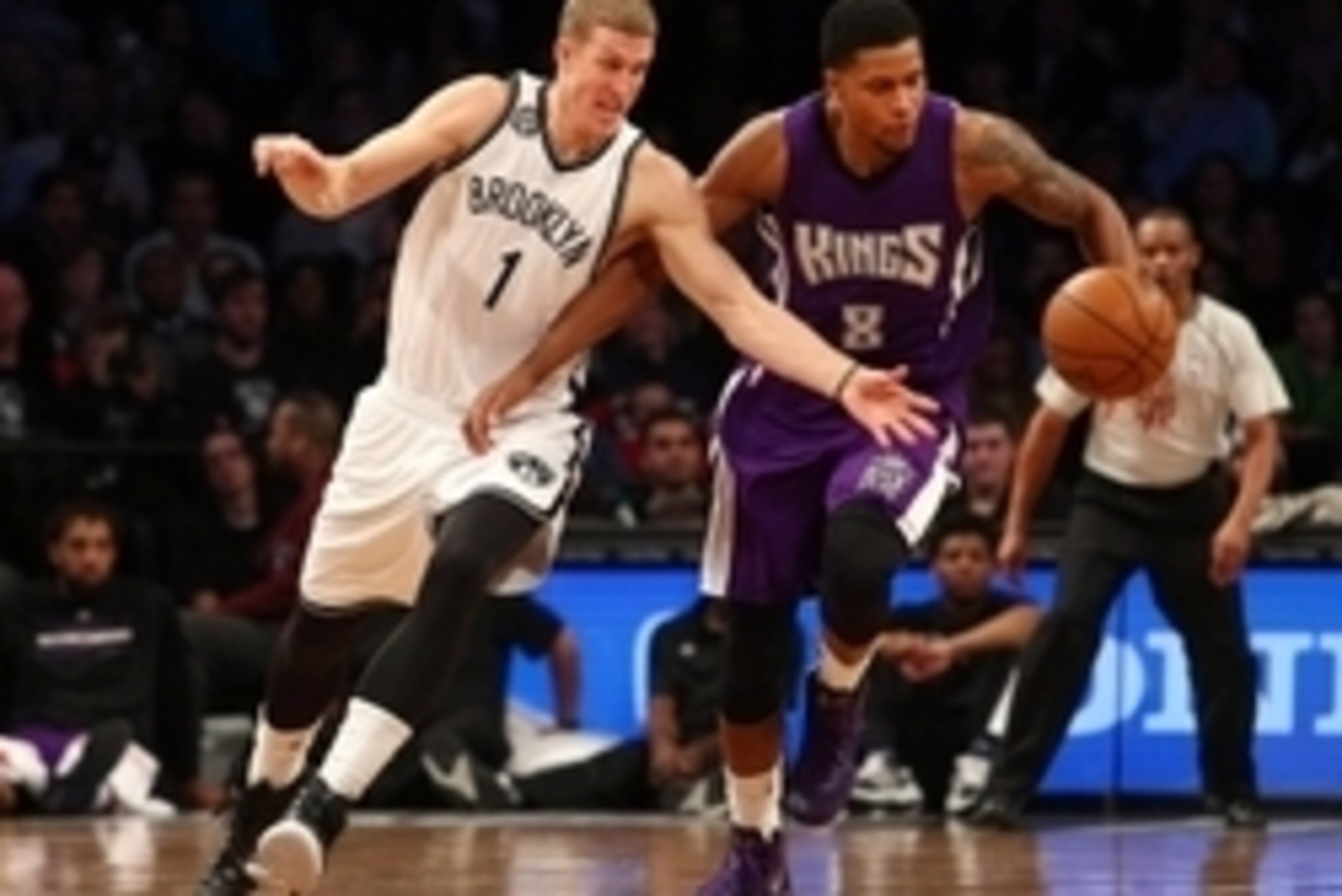 Dec 29, 2014; Brooklyn, NY, USA; Sacramento Kings small forward Rudy Gay (8) and Brooklyn Nets center Mason Plumlee (1) fight for a loose ball during the fourth quarter at Barclays Center. The Nets defeated the Kings 107-99. Mandatory Credit: Brad Penner-