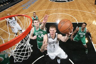 BROOKLYN, NY - JANUARY 7:  Mason Plumlee #1 of the Brooklyn Nets shoots the ball against the Boston Celtics during the game on January 7, 2015 at Barclays Center in Brooklyn, New York. NOTE TO USER: User expressly acknowledges and agrees that, by download