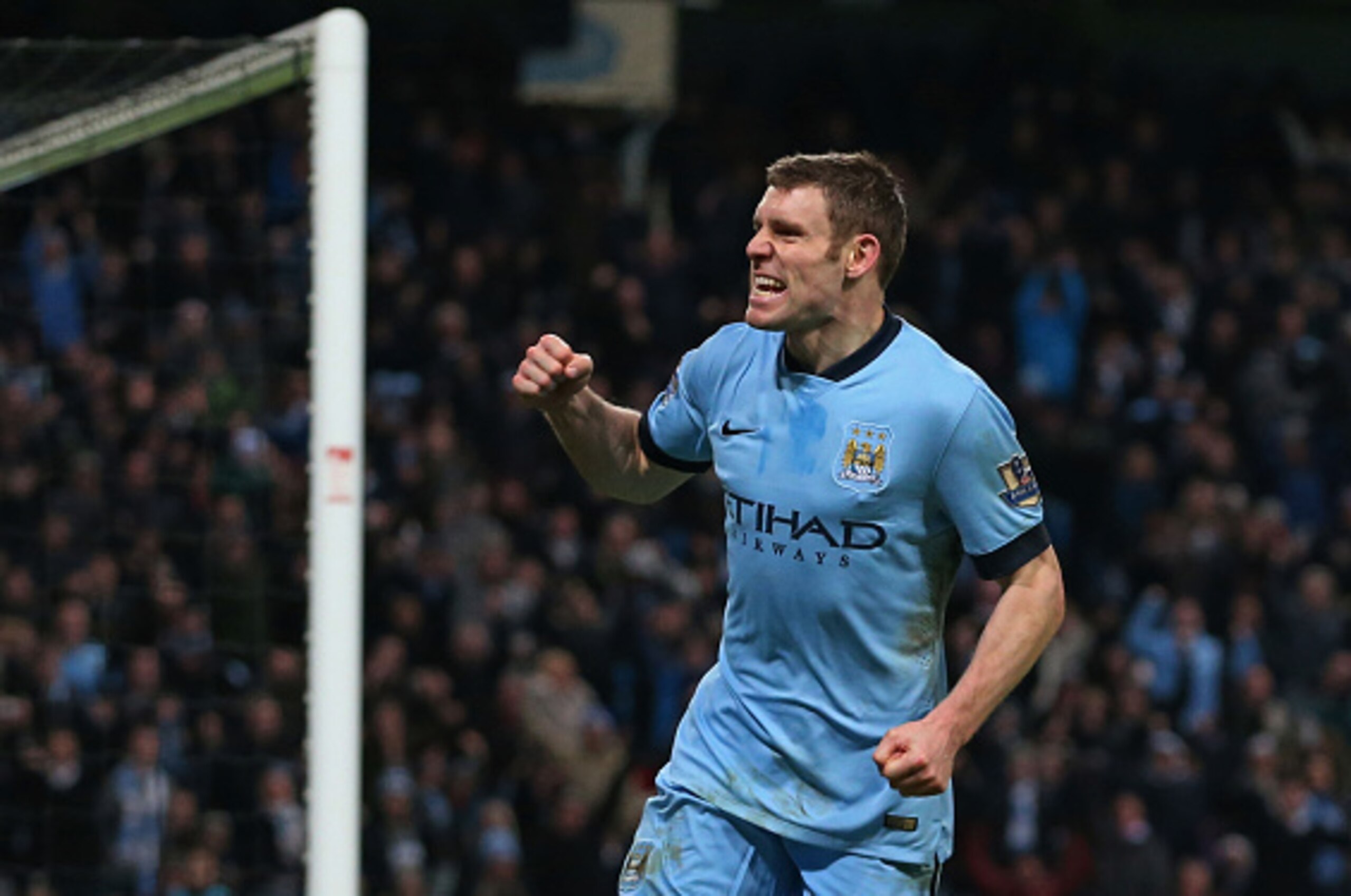 MANCHESTER, ENGLAND - JANUARY 04:  James Milner of Manchester City celebrates after scoring a goal to level the scores at 1-1 during the FA Cup Third Round match between  Manchester City and Sheffield Wednesday at Etihad Stadium on January 4, 2015 in Manc