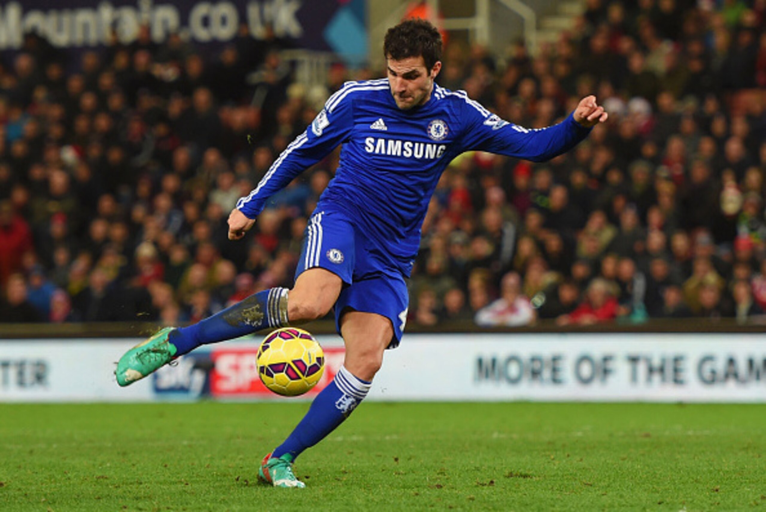 STOKE ON TRENT, ENGLAND - DECEMBER 22:  Cesc Fabregas of Chelsea scores their second goal during the Barclays Premier League match between Stoke City and Chelsea at Britannia Stadium on December 22, 2014 in Stoke on Trent, England.  (Photo by Michael Rega