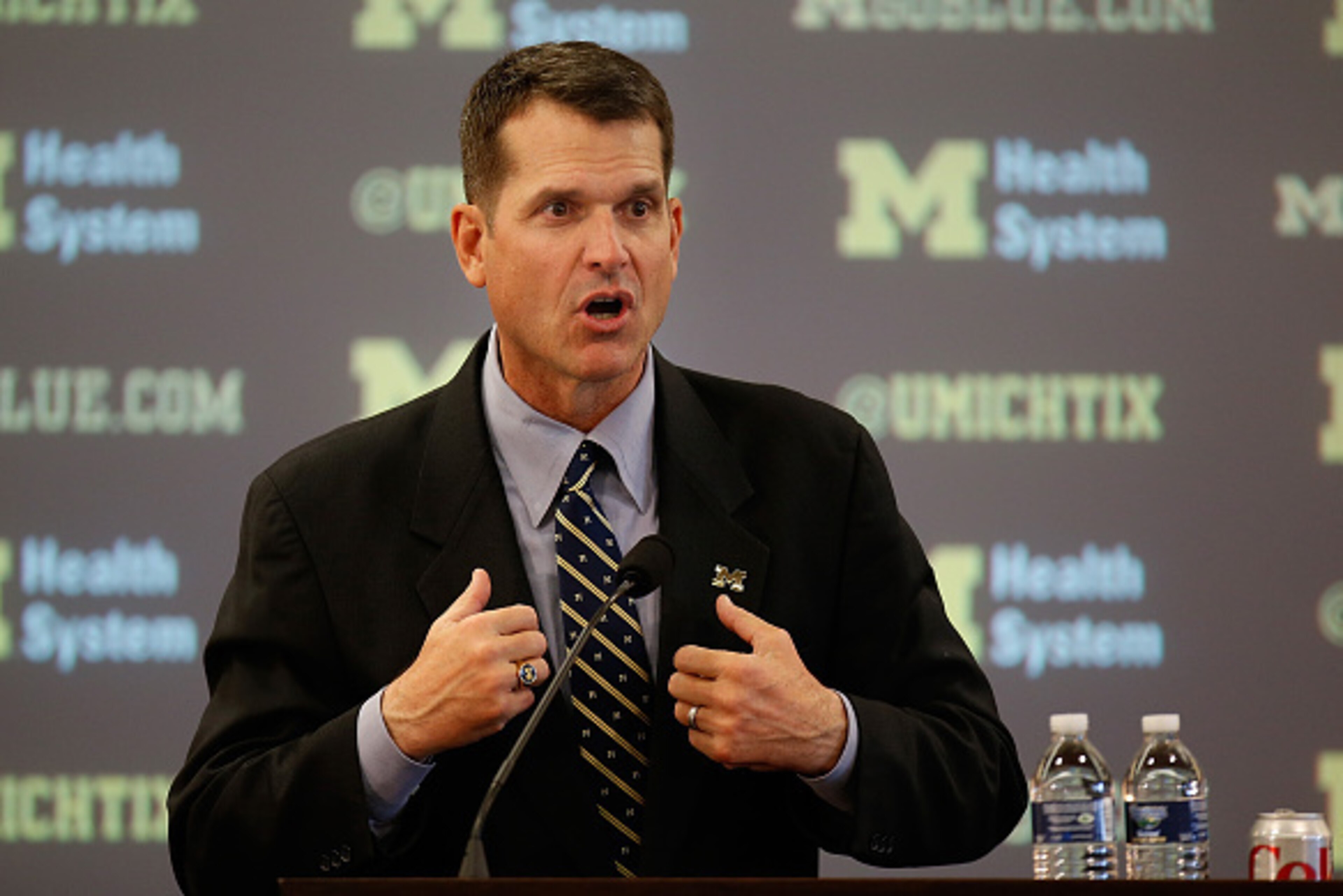 ANN ARBOR, MI - DECEMBER 30:  Jim Harbaugh speaks as he is introduced as the new Head Coach of the University of Michigan football team at the Junge Family Champions Center on December 30, 2014 in Ann Arbor, Michigan.  (Photo by Gregory Shamus/Getty Image