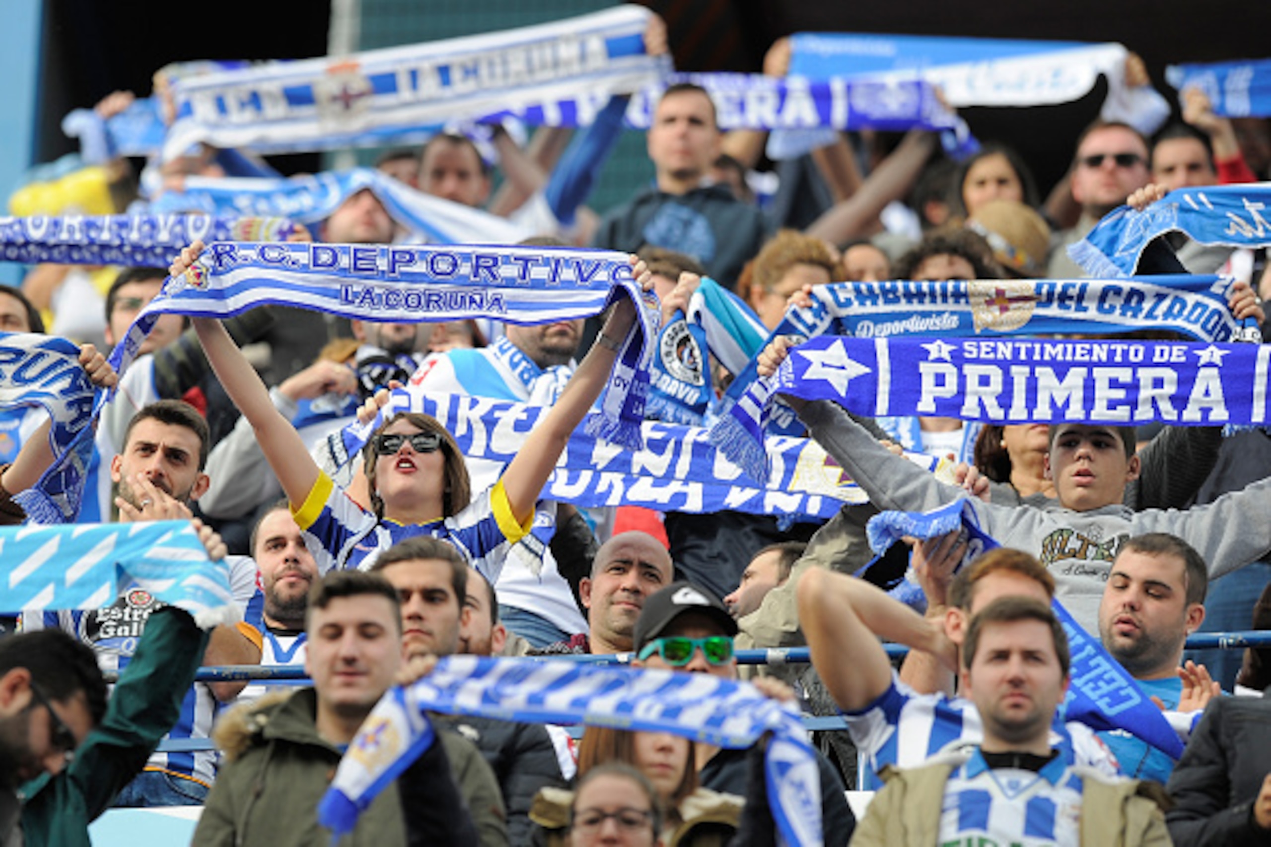 MADRID, SPAIN - NOVEMBER 30: RC Deportivo La Coruna fans cheers their team during the La Liga match between Club Atletico de Madrid and RC Deportivo La Coruna at Vicente Calderon Stadium on November 30, 2014 in Madrid, Spain. An RC Deportivo La Coruna MADRID, SPAIN - NOVEMBER 30: RC Deportivo La Coruna fans cheers their team during the La Liga match between Club Atletico de Madrid and RC Deportivo La Coruna at Vicente Calderon Stadium on November 30, 2014 in Madrid, Spain. An RC Deportivo La Coruna