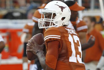 AUSTIN, TX - SEPTEMBER 6: Jerrod Heard #13 of the Texas Longhorns passes during pre game warmups before playing the BYU Cougars on September 6, 2014 at Darrell K Royal-Texas Memorial Stadium in Austin, Texas. (Photo by Chris Covatta/Getty Images)