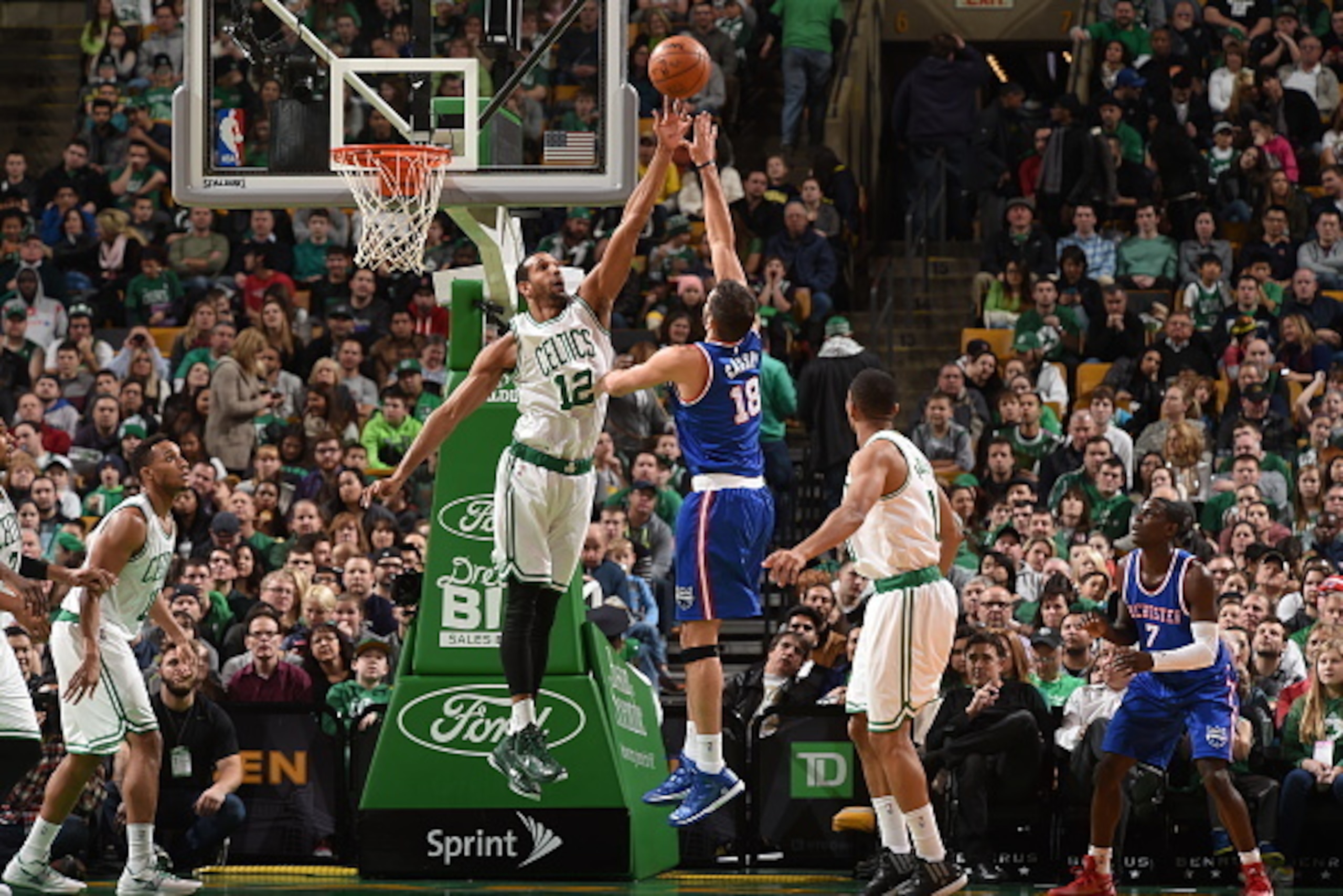 BOSTON, MA - DECEMBER 31:  Omri Casspi #18 of the Sacramento Kings drives to the basket and shoots over Brandan Wright #12 of the Boston Celtics on December 31, 2014 at the TD Garden in Boston, Massachusetts. NOTE TO USER: User expressly acknowledges and 