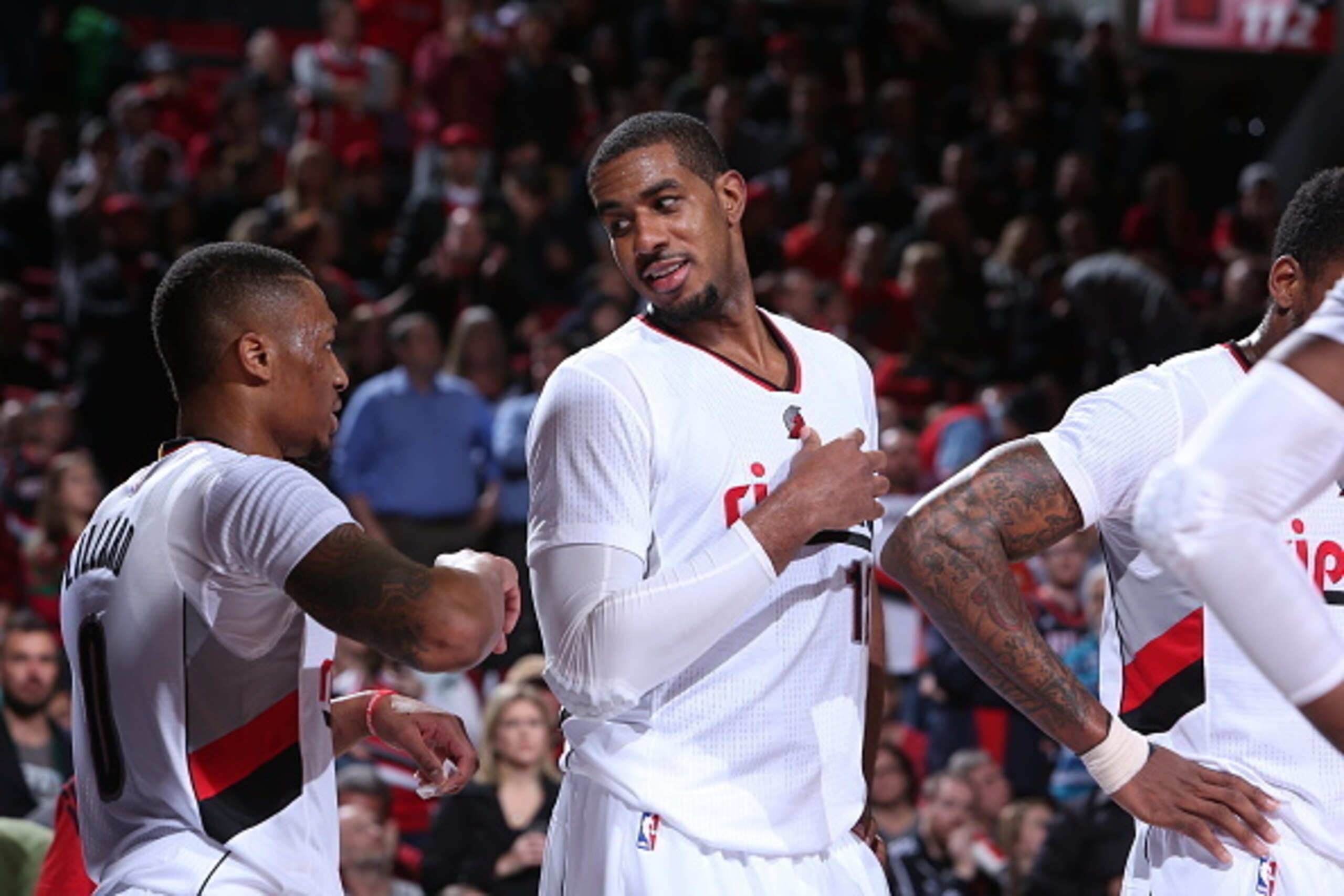 PORTLAND, OR - DECEMBER 17:  LaMarcus Aldridge #12 of the Portland Trail Blazers talks to Damian Lillard #0 against the Milwaukee Bucks on December 17, 2014 at the Moda Center Arena in Portland, Oregon. NOTE TO USER: User expressly acknowledges and agrees