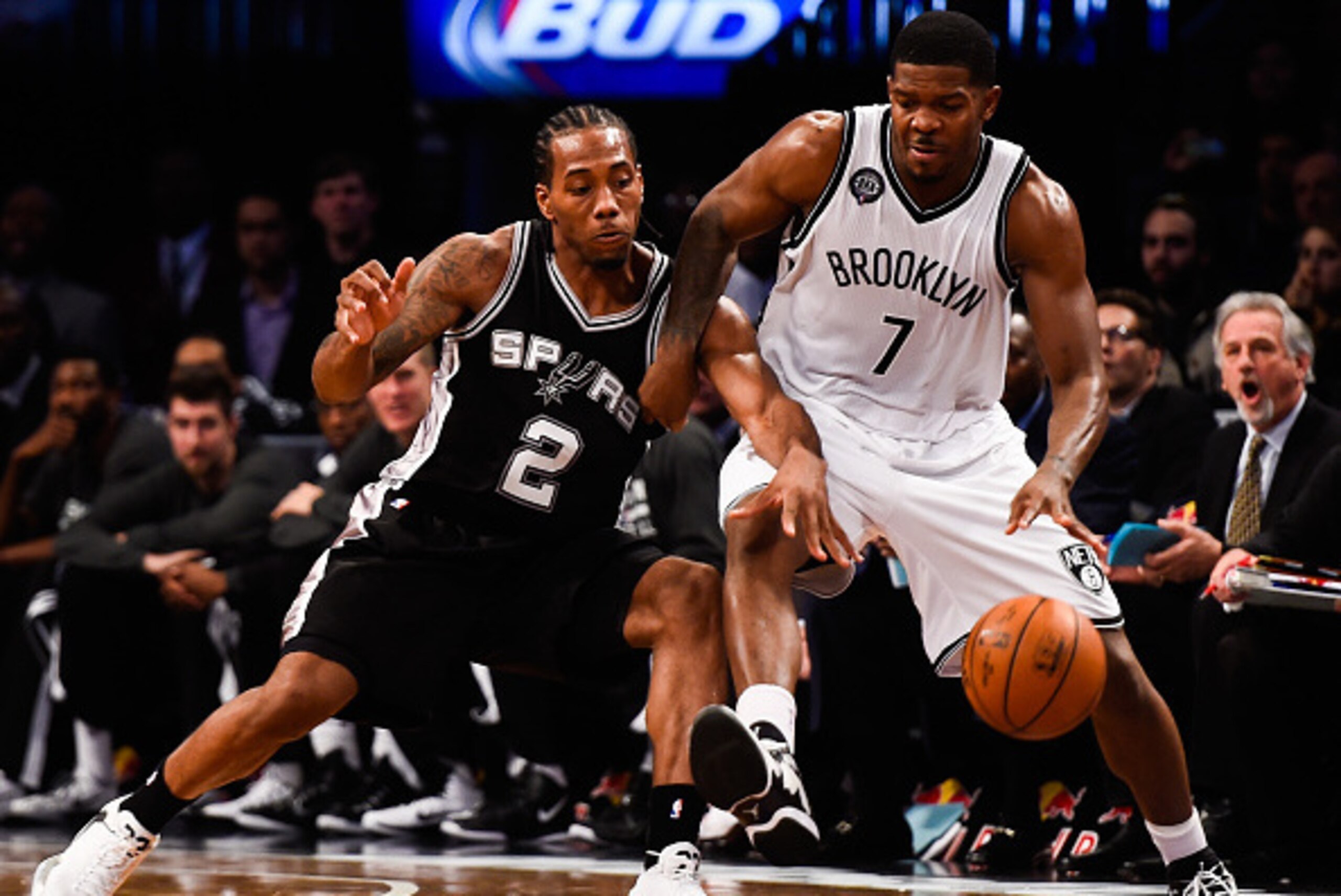NEW YORK, NY - DECEMBER 03: Kawhi Leonard #2 of the San Antonio Spurs guards Joe Johnson #7 of the Brooklyn Nets during a game at the Barclays Center on December 3, 2014 in the Brooklyn borough of New York City. NOTE TO USER: User expressly acknowledges a
