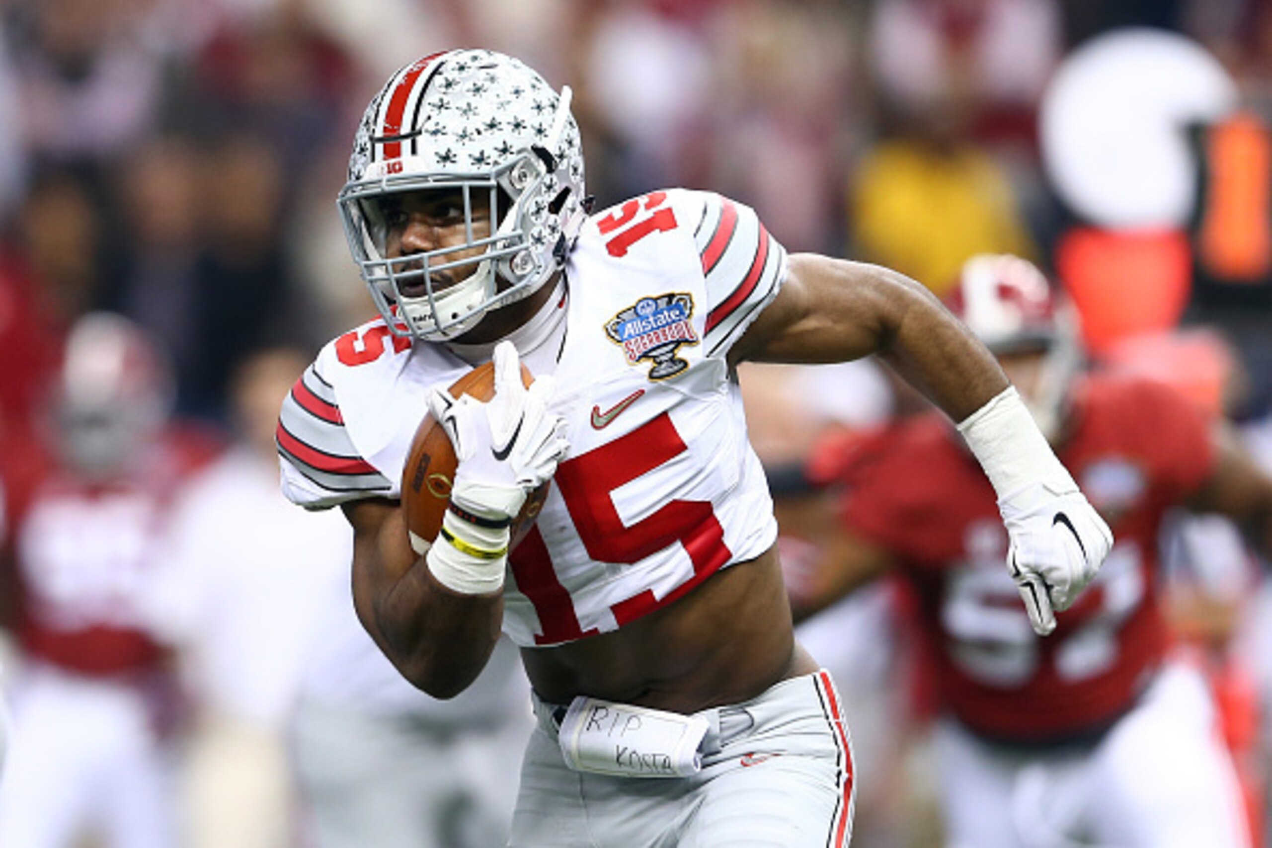 NEW ORLEANS, LA - JANUARY 01:  Ezekiel Elliott #15 of the Ohio State Buckeyes runs the ball against the Alabama Crimson Tide during the All State Sugar Bowl at the Mercedes-Benz Superdome on January 1, 2015 in New Orleans, Louisiana.  (Photo by Streeter L