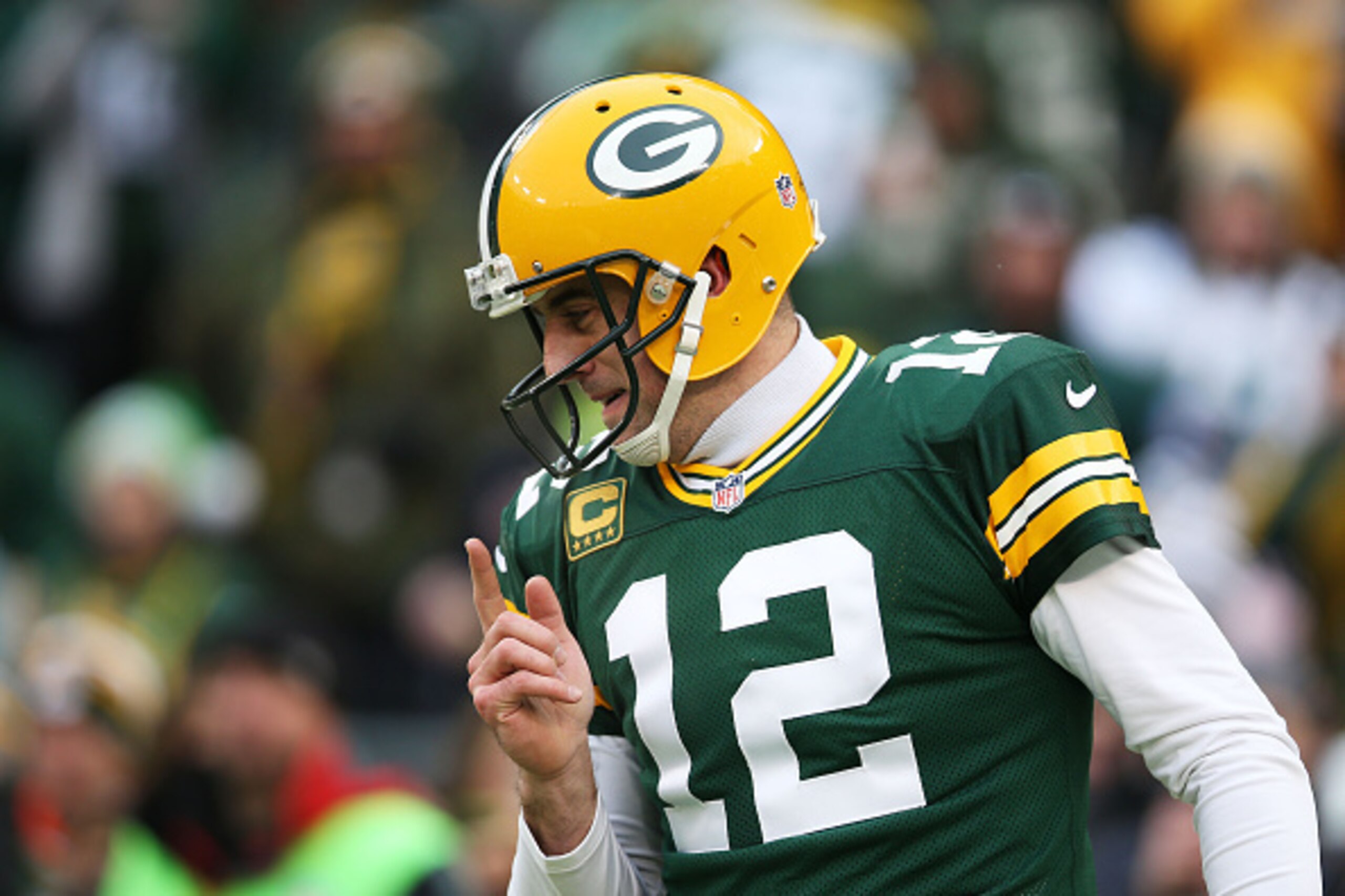 GREEN BAY, WI - DECEMBER 28:  Aaron Rodgers #12 of the Green Bay Packers reacts in the first quarter against the Detroit Lions at Lambeau Field on December 28, 2014 in Green Bay, Wisconsin.  (Photo by Chris Graythen/Getty Images)
