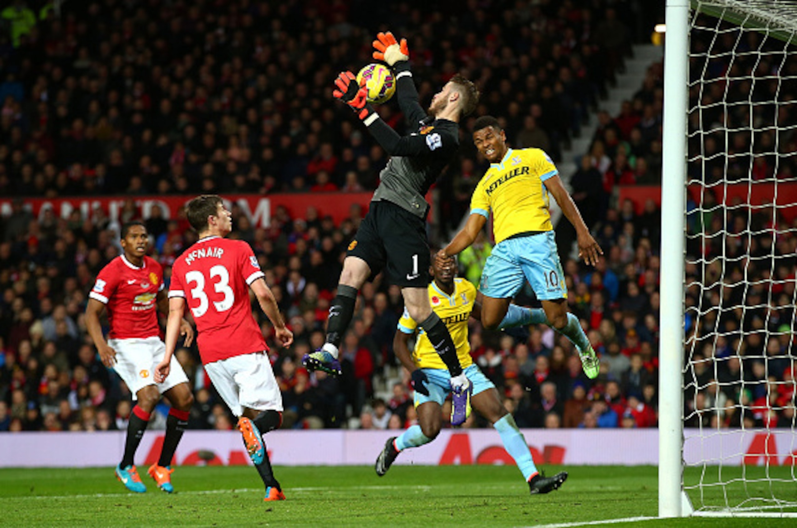 MANCHESTER, ENGLAND - NOVEMBER 08:  David De Gea of Manchester United saves the attempt on goal of Frazier Cambell of Crystal Palace during the Barclays Premier League match between Manchester United and Crystal Palace at Old Trafford on November 8, 2014 