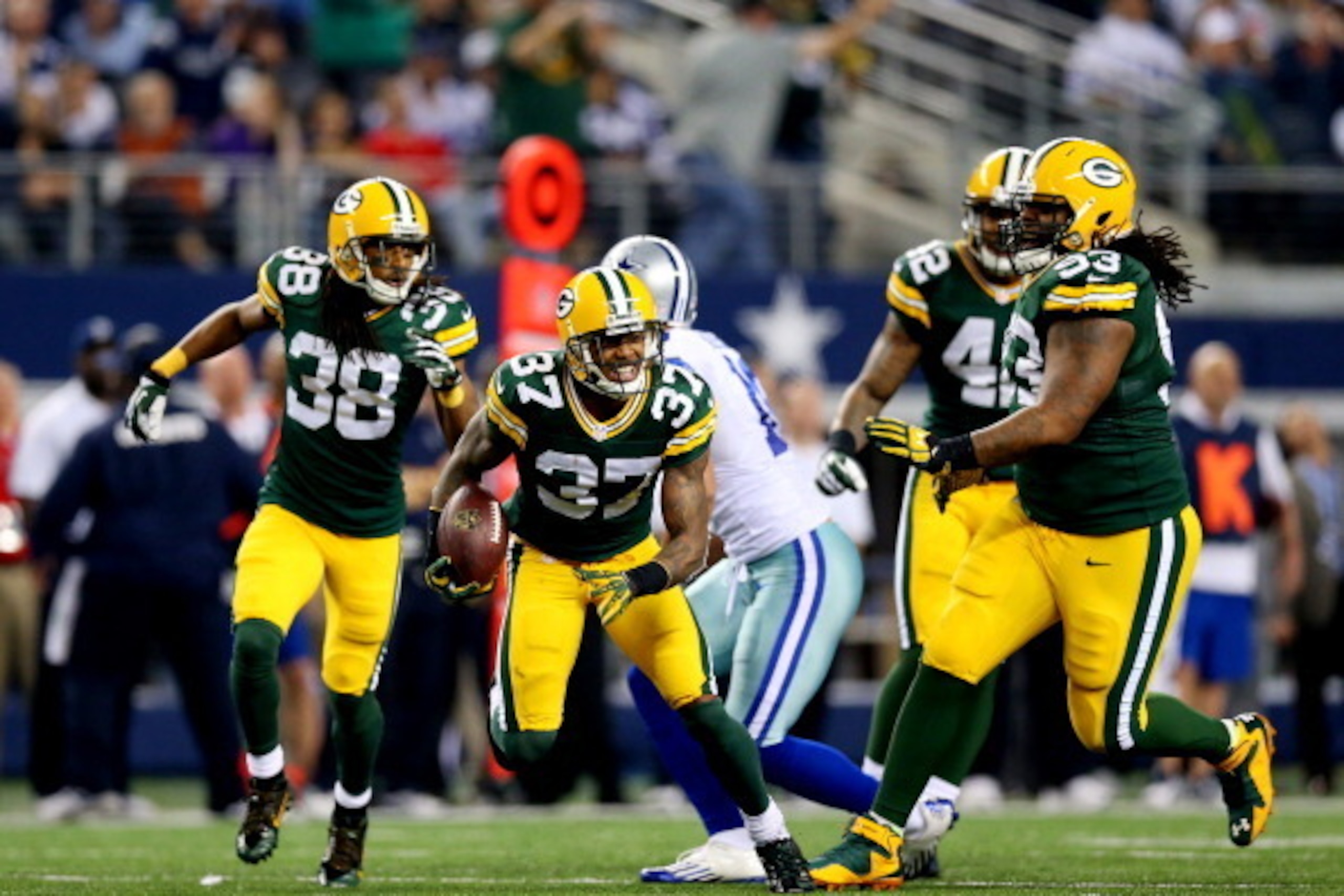 ARLINGTON, TX - DECEMBER 15: Cornerback Sam Shields #37 of the Green Bay Packers celebrates a fourth quarter interception against the Dallas Cowboys during a game at AT&T Stadium on December 15, 2013 in Arlington, Texas.  (Photo by Ronald Martinez/Getty I